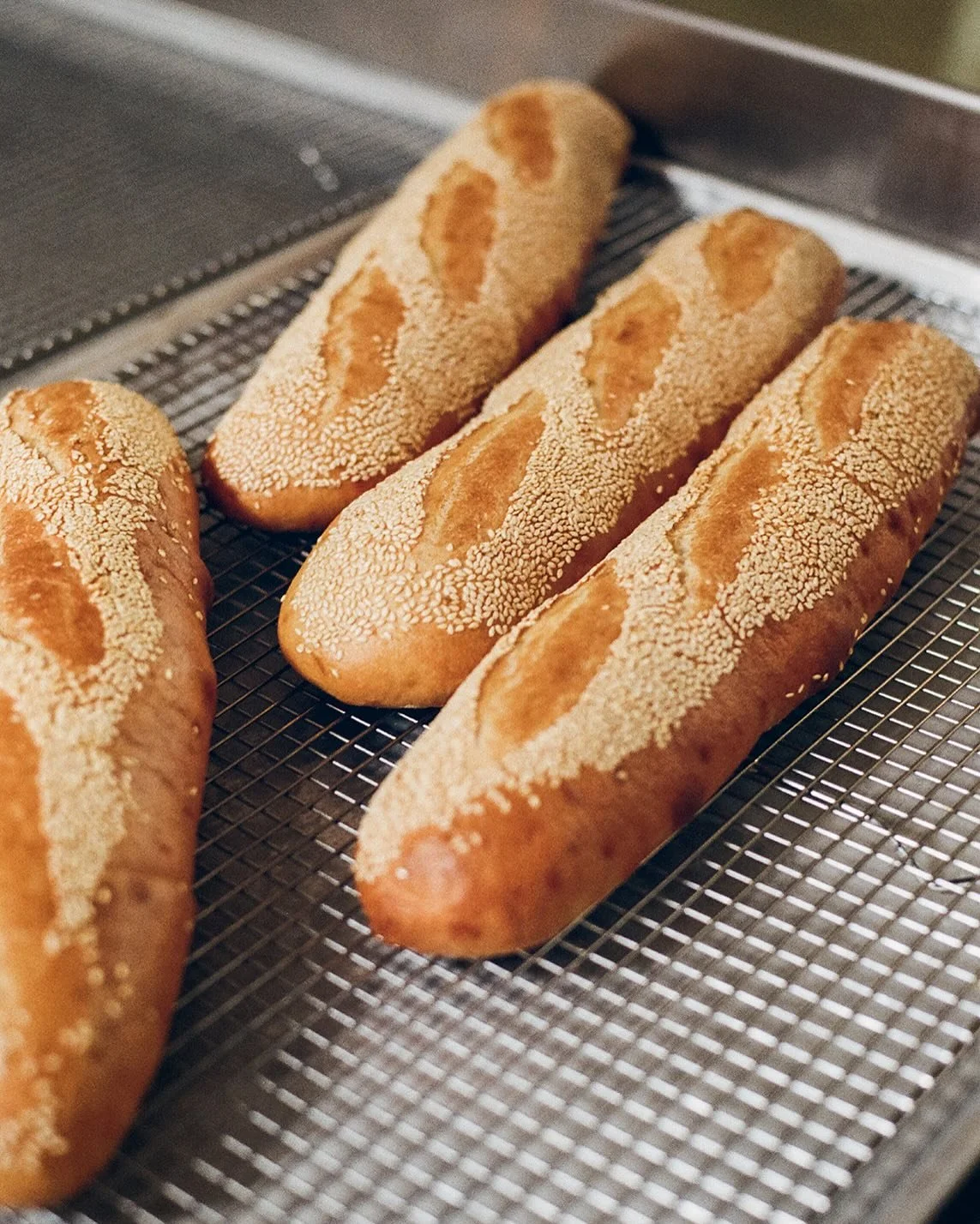 Sesame seeded rolls. Made in-house. Every morning.