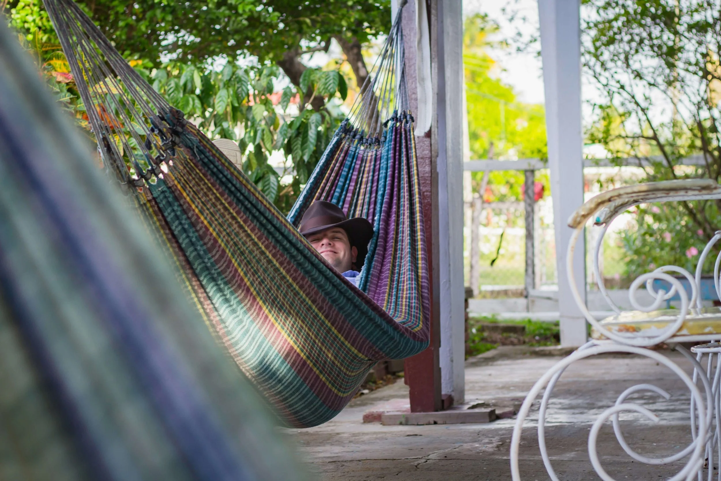 A person in a hammock representing the developmental movement of yield and yoga nidra - practices in somatic therapy offered by Reclaiming Beauty, a therapy practice for eating disorders in Asheville, North Carolina and virtually in NC and SC.