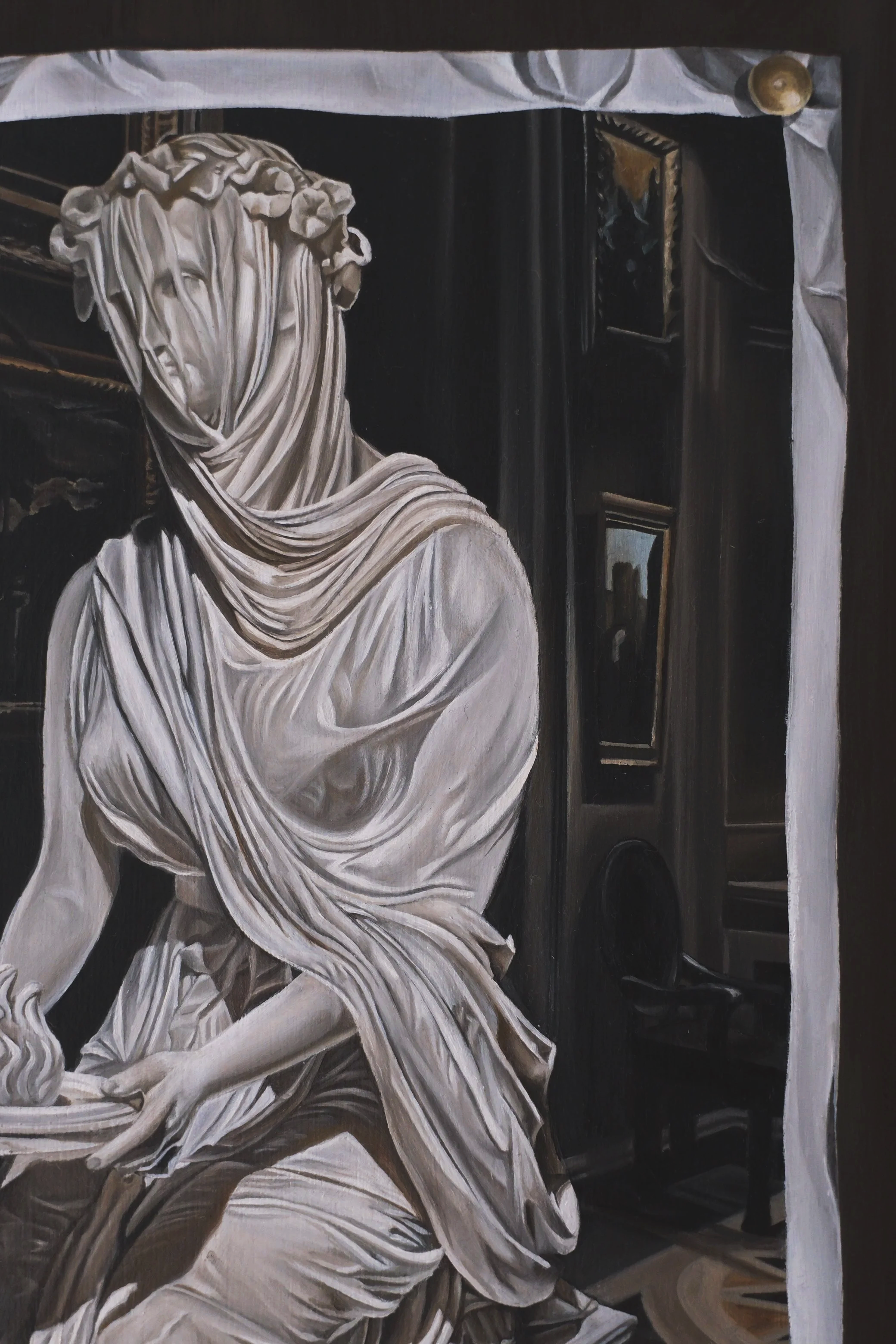 A close up of a trompe l'oeil painting of a crumpled photographed of a classical white marble statue of a kneeling woman holding a flame. Painted to look like the image is pinned to a dark wooden background.