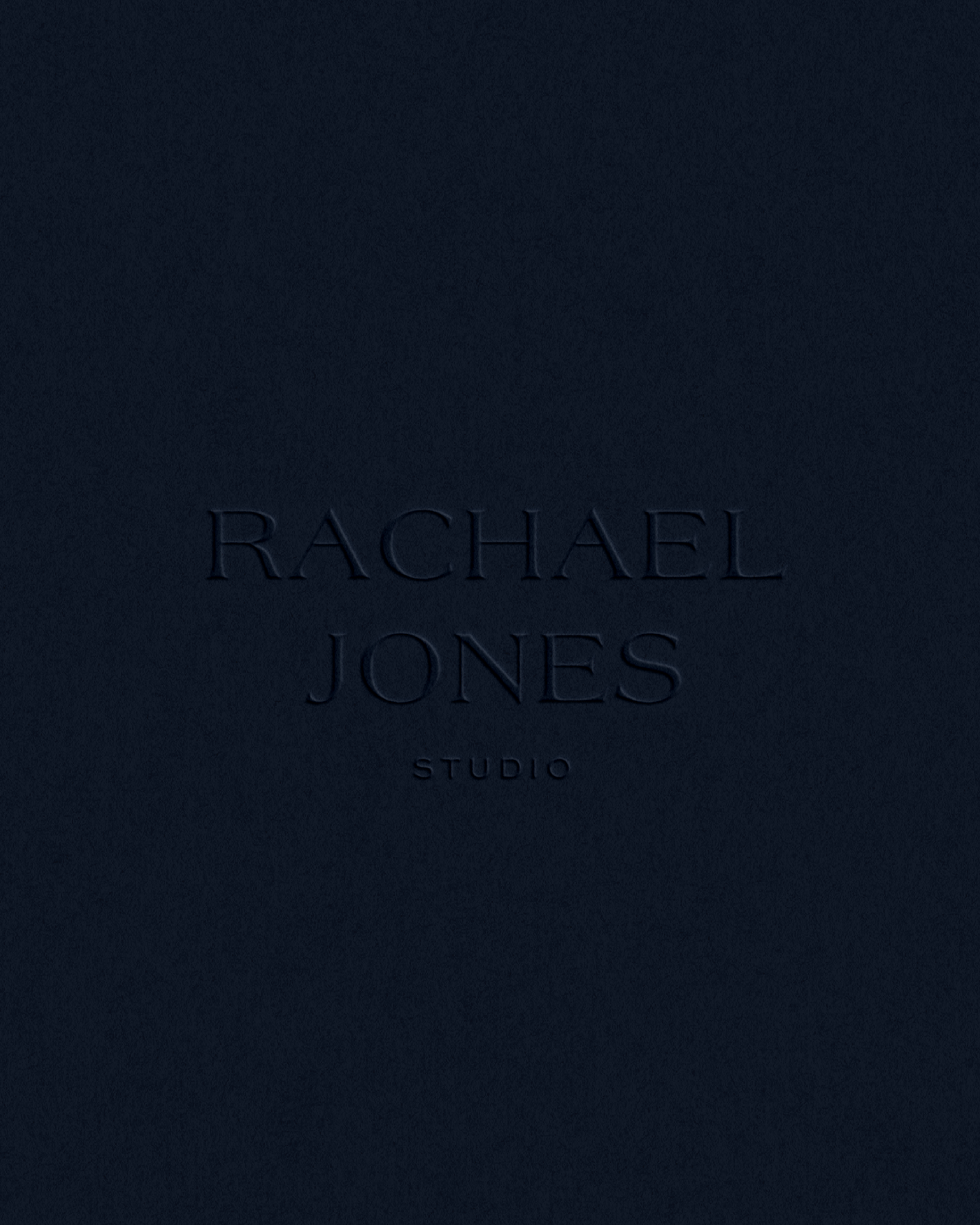 Embossed Rachael Jones workdmark on deep inky blue background