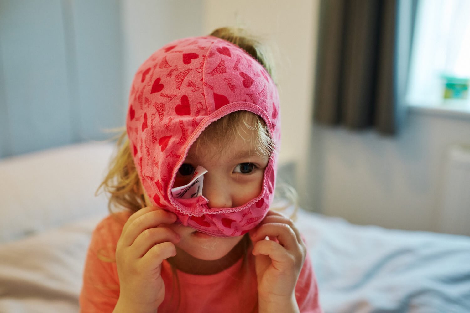 Documentary Family Photography in Dorset - Daisy with her pants hat