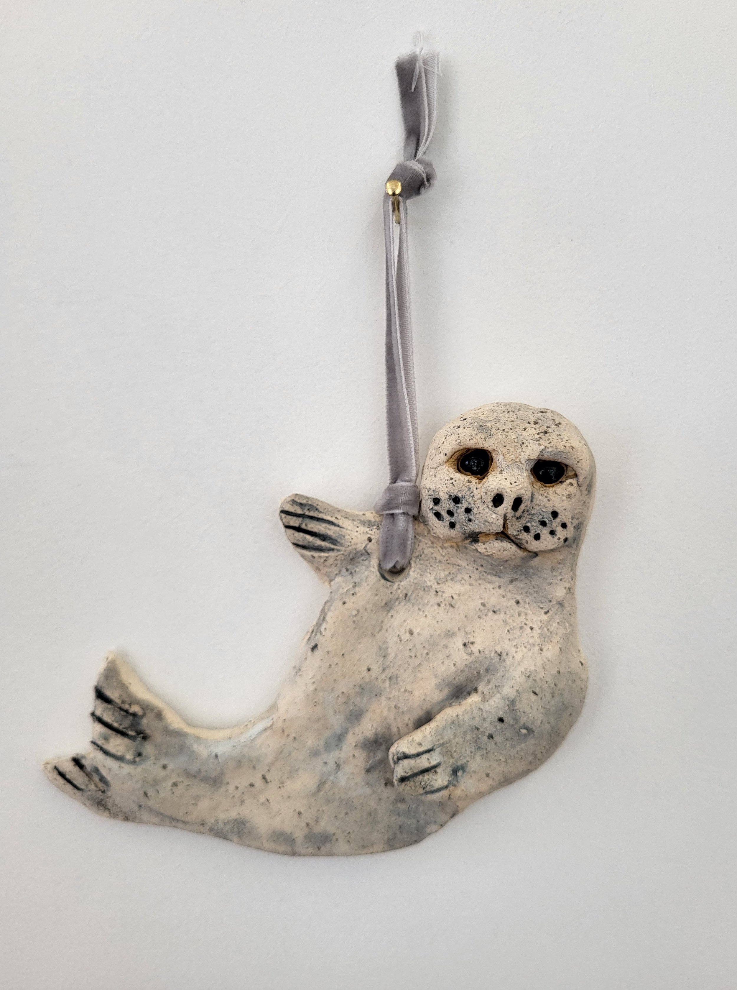 Sassy seal hanging charm