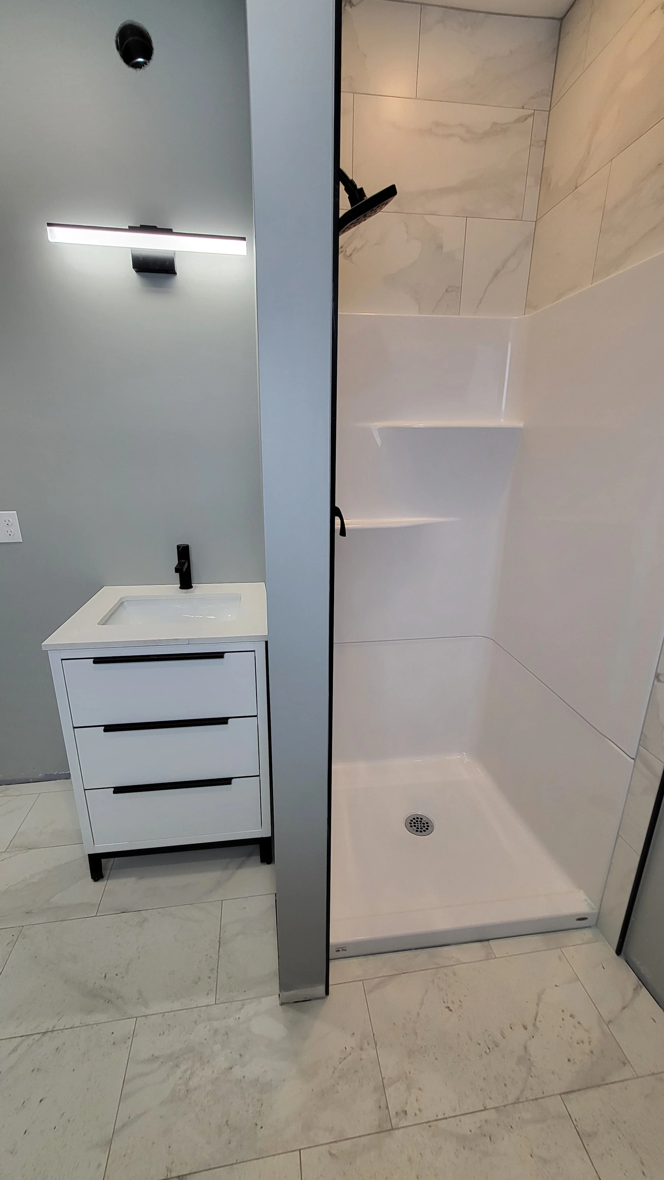 Groundlevel washroom sink and shower.jpg