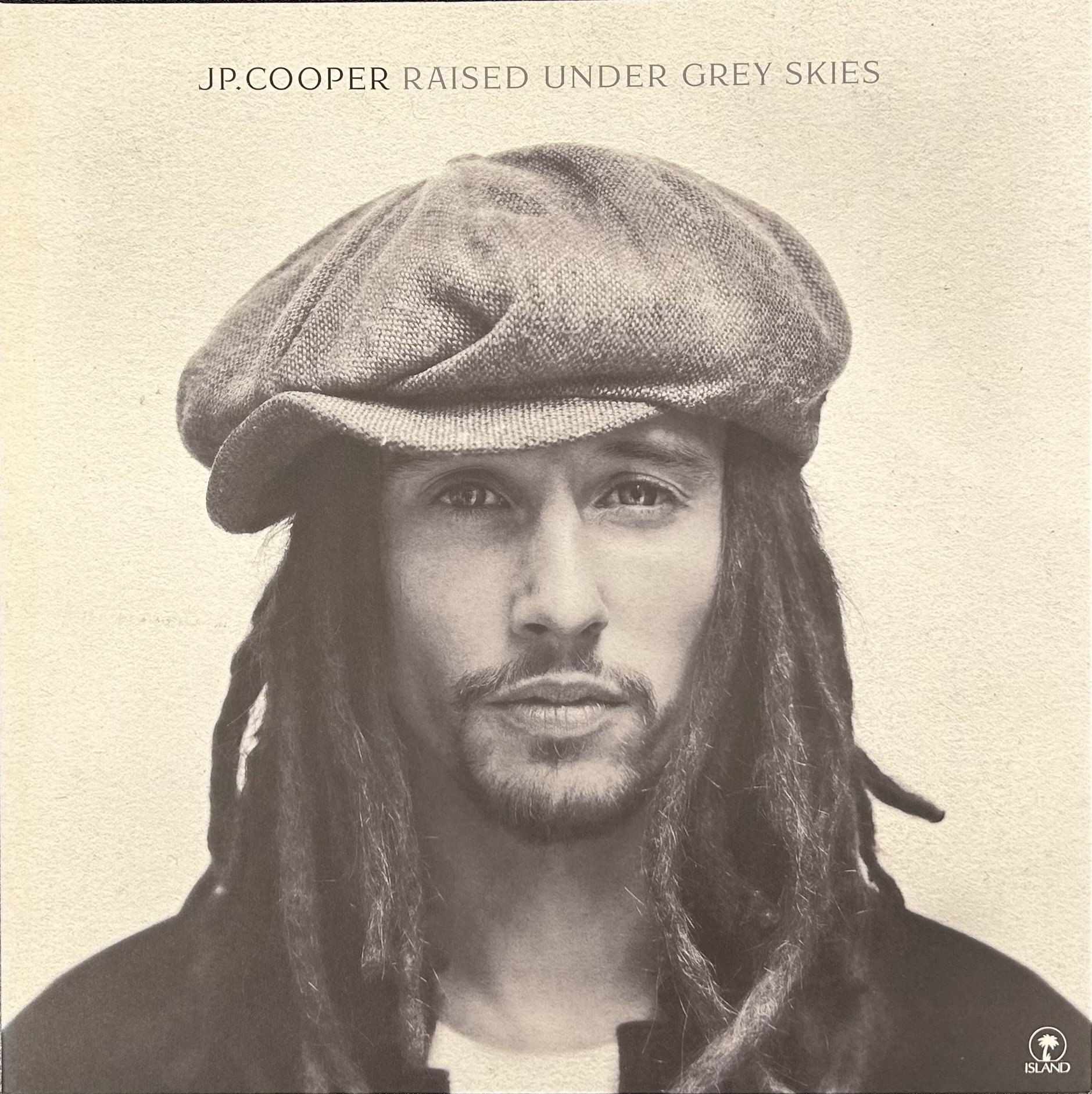 JP Cooper's Raised Under Grey Skies album cover