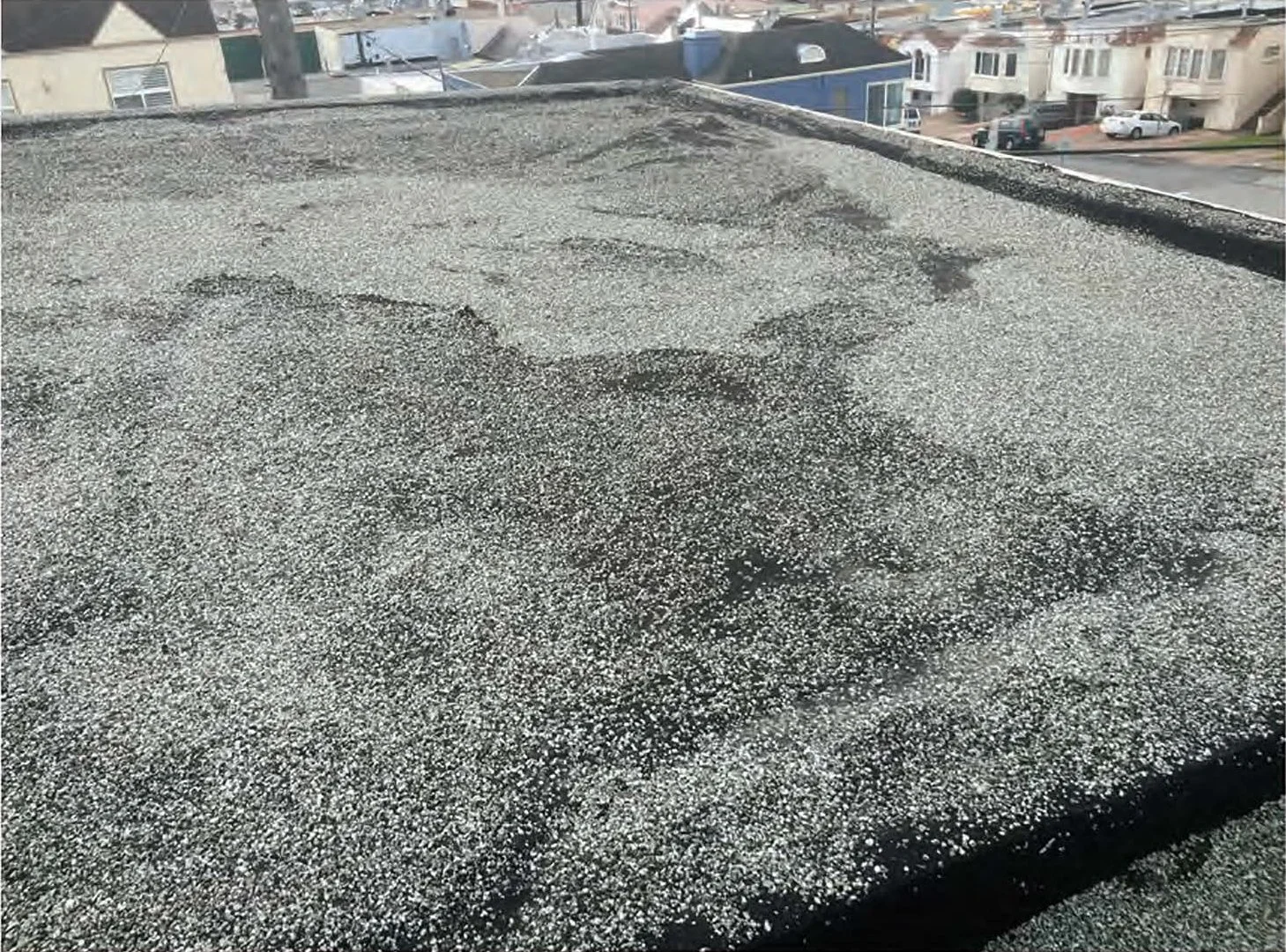 "Tar and gravel roof issues: Eroded gravel, exposed tar membrane. Loose or rusted flashings."