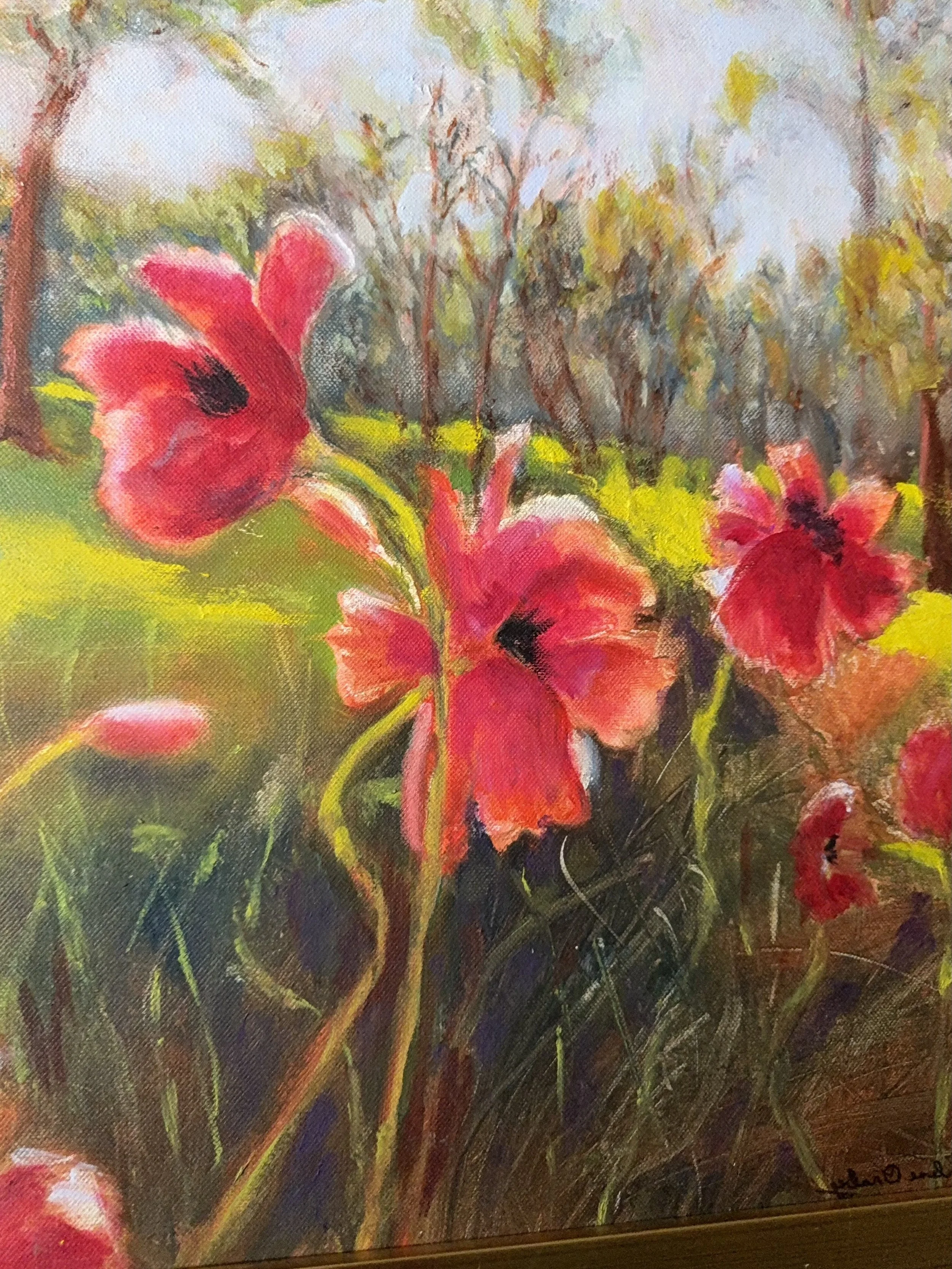 A painting of pink and red flowers in a field with green grass, trees, and a cloudy sky in the background.