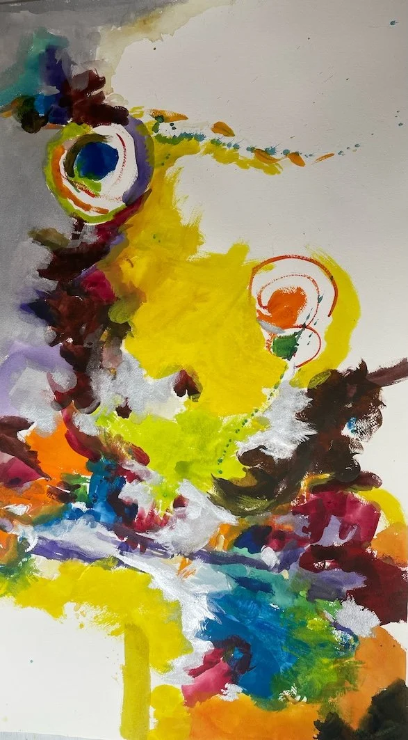 Abstract watercolor painting featuring vibrant colors, with dominant yellow, blue, red, purple, and green, creating a dynamic and expressive composition.