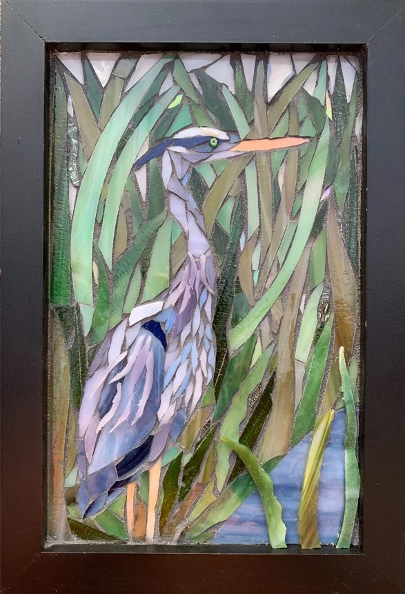 A glass mosaic of a great blue heron