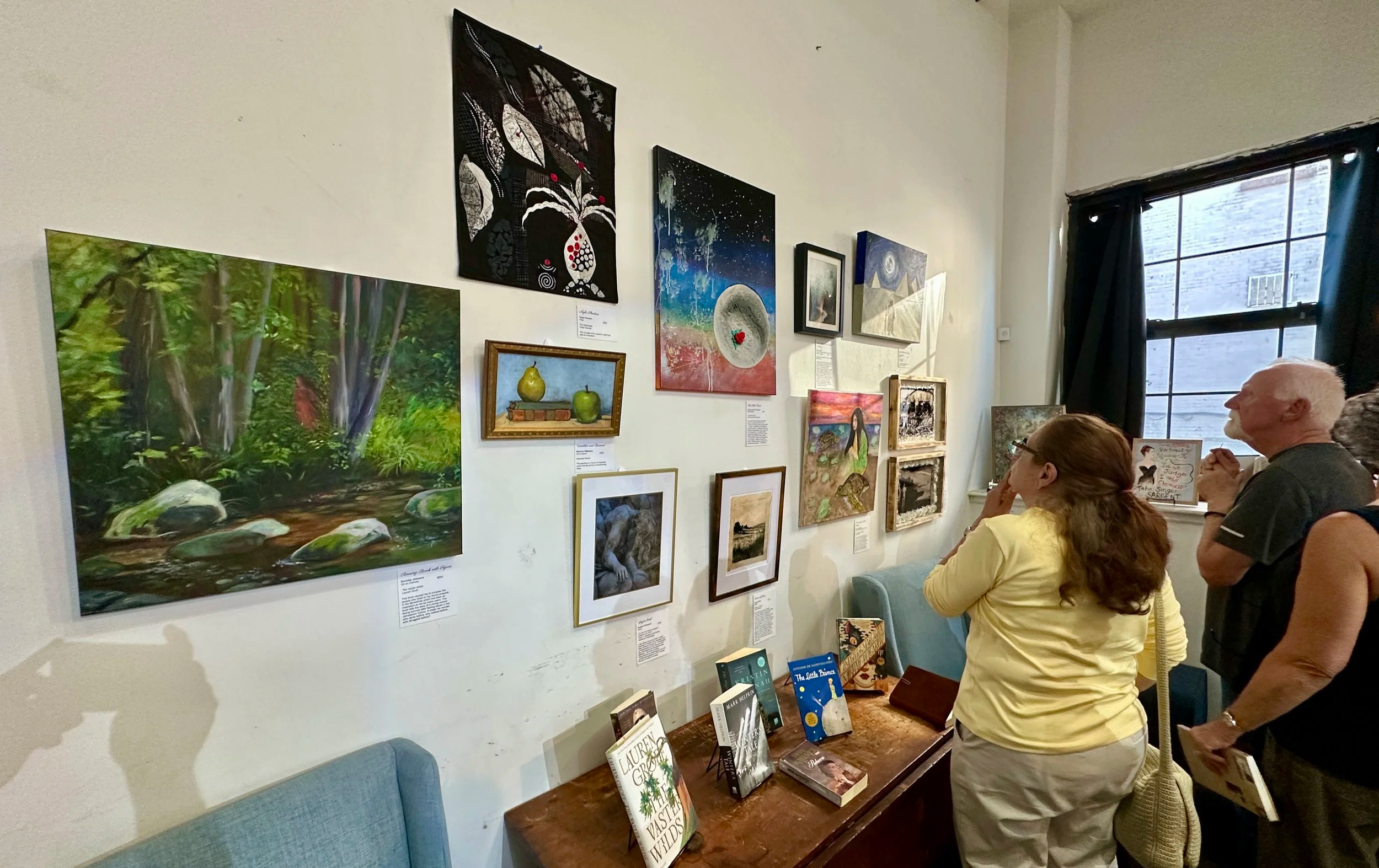 A woman and a man viewing artwork