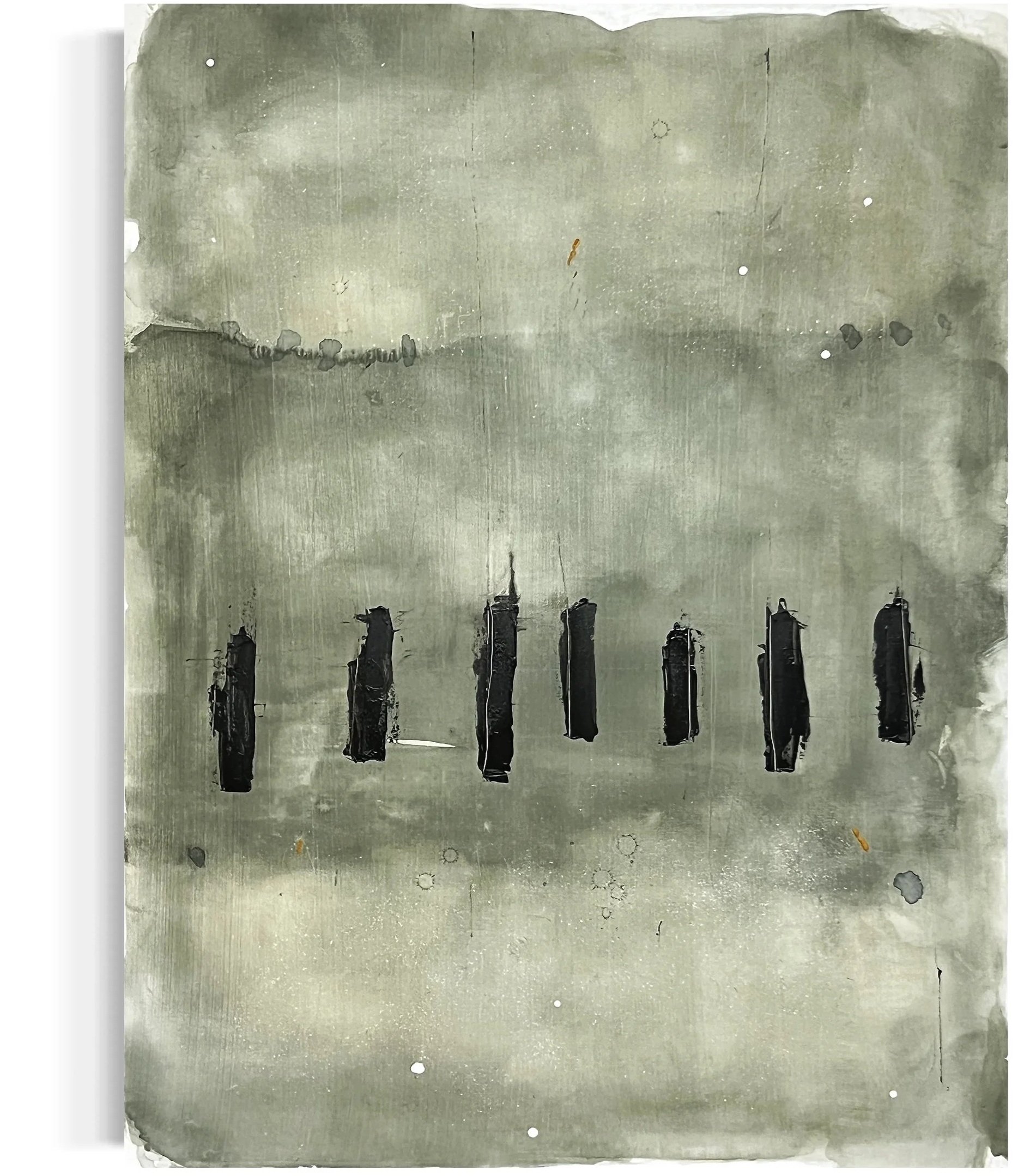 A metal plate with black ink marks and scratches, featuring multiple small drilled holes and a few larger circular indentations. The bottom of the plate has irregular edges with some areas appearing torn or worn.