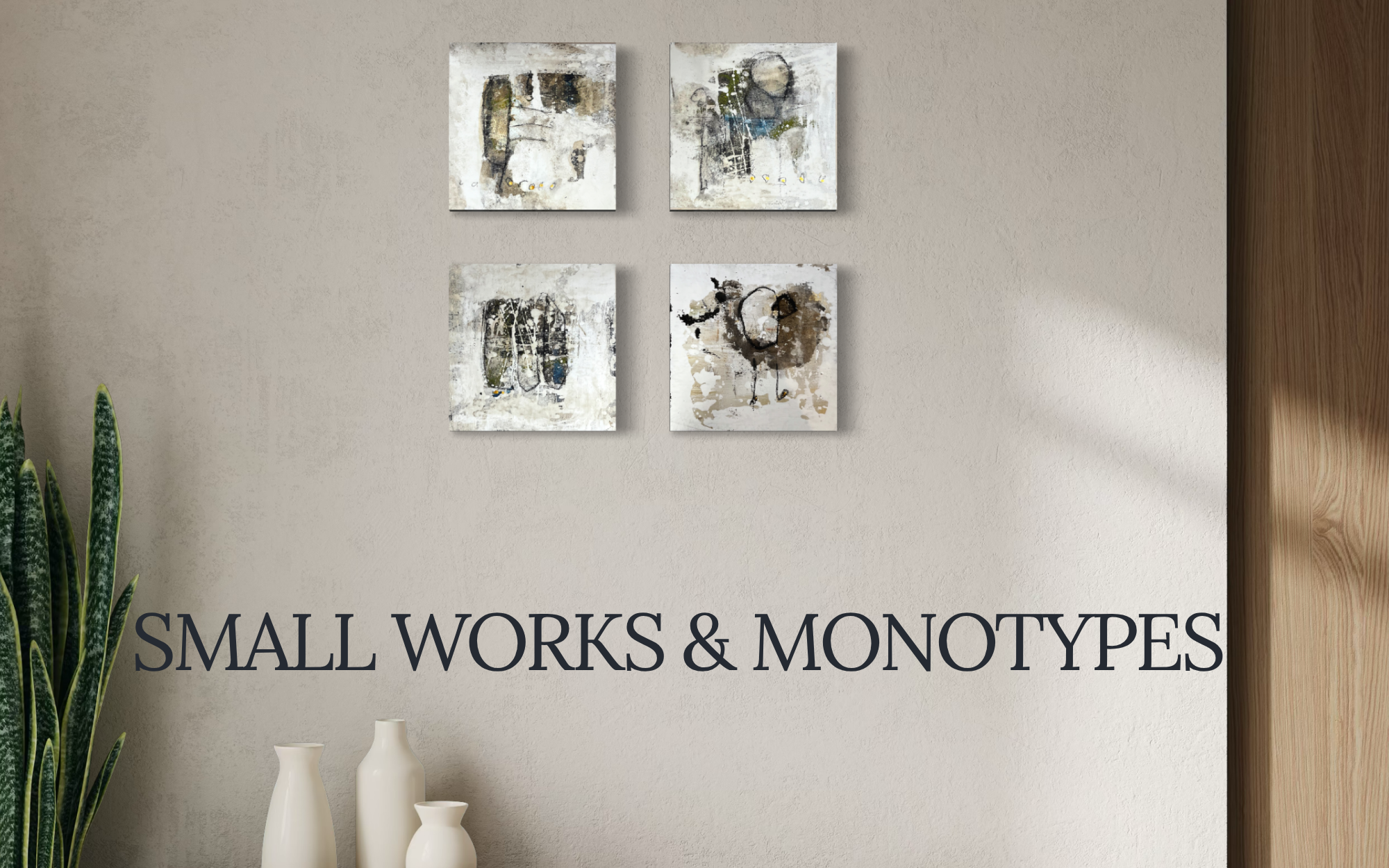 Interior wall decorated with four small abstract art pieces, some white vases on a shelf below, and a large plant to the left, with the partial text 'SMALL WORKS & MONOTYPES' visible at the bottom.