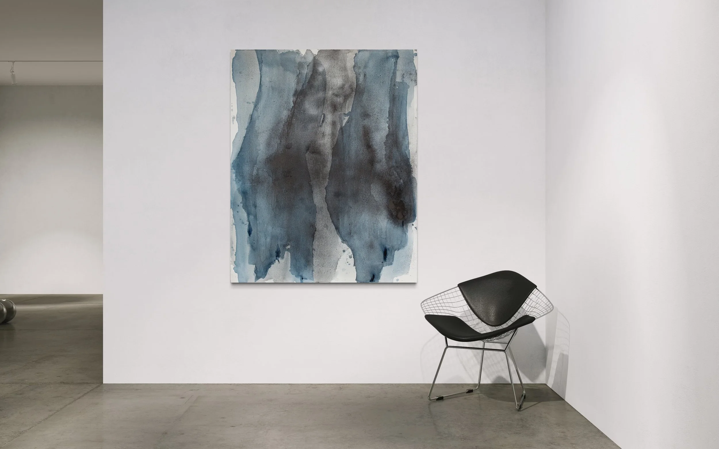 A minimalist art gallery with a large abstract watercolor painting in shades of blue and gray hanging on a white wall, with a black wire chair in front of it.