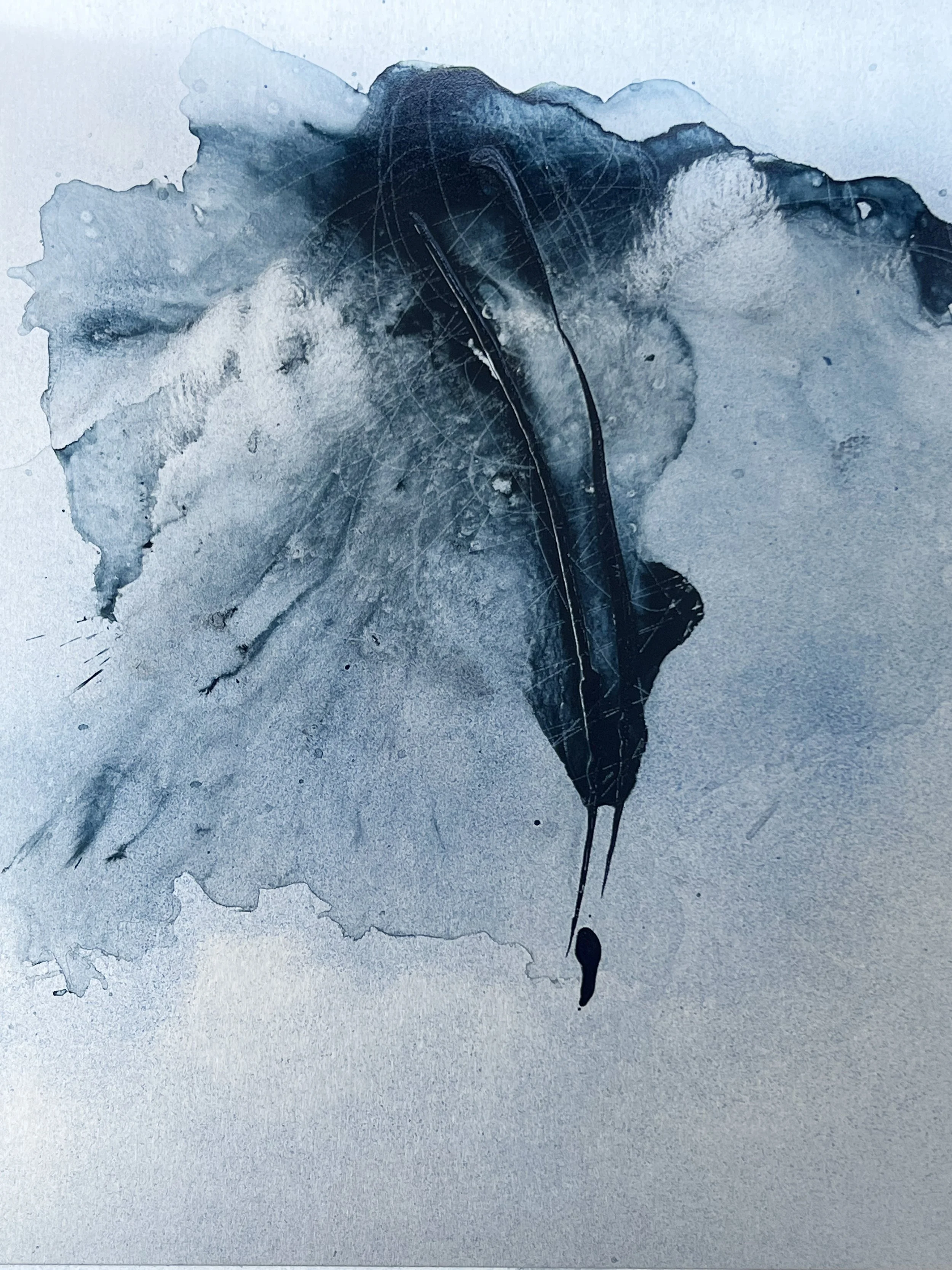 Abstract watercolor painting with shades of blue and black, and dripping ink stain.