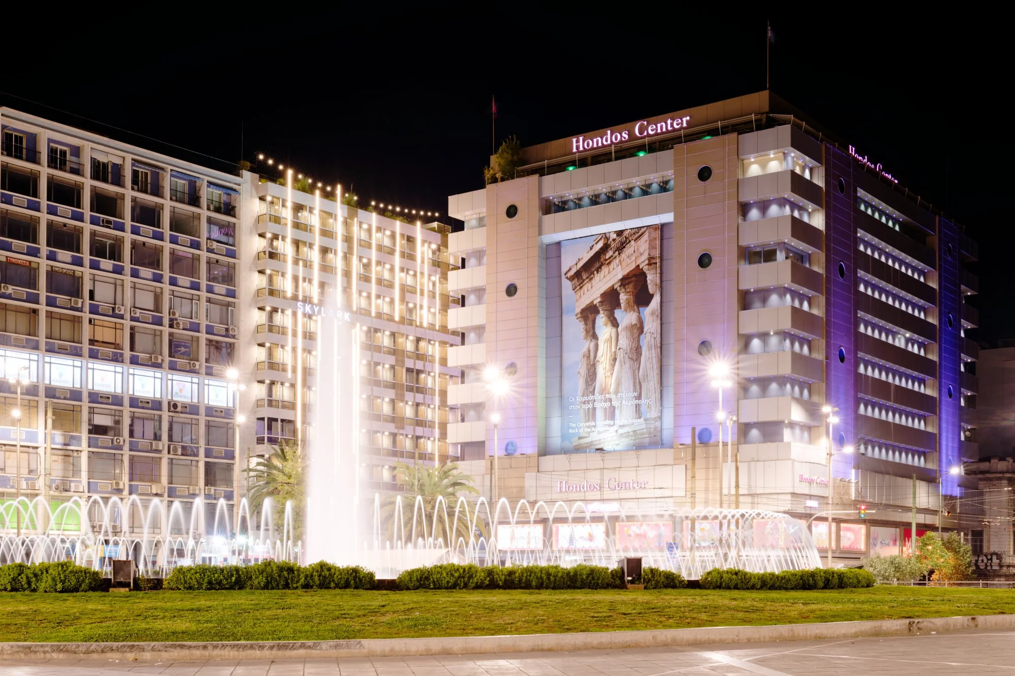 Hondos Center at night, Omonoia Square, Athens, Greece.  Photograph by Douglas Seigars.