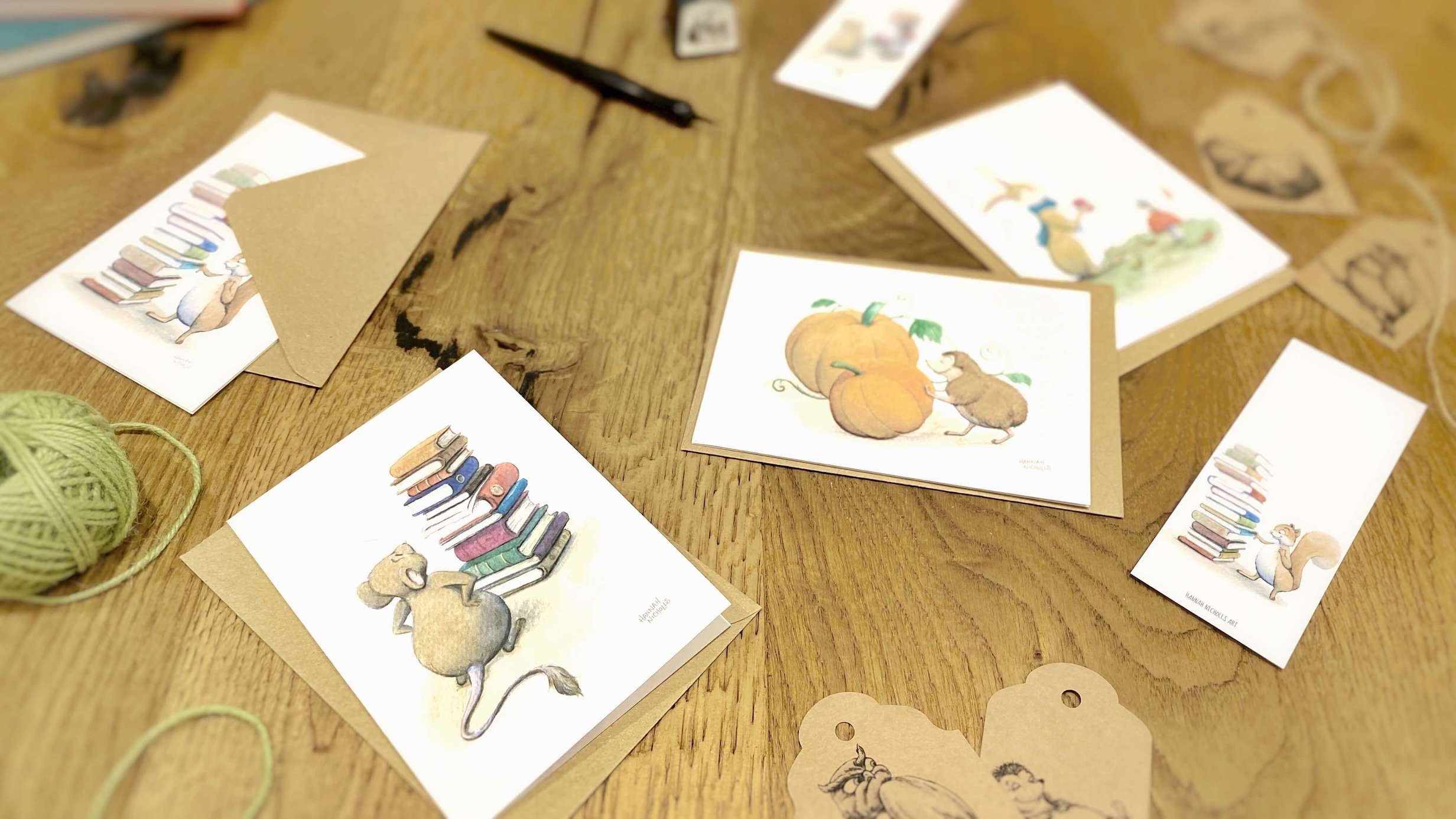 flat-lay-photo-on-a-rustic-wooden-surface-showing-a-collection-of-autumnal-stationery-by-hannah-nicholls