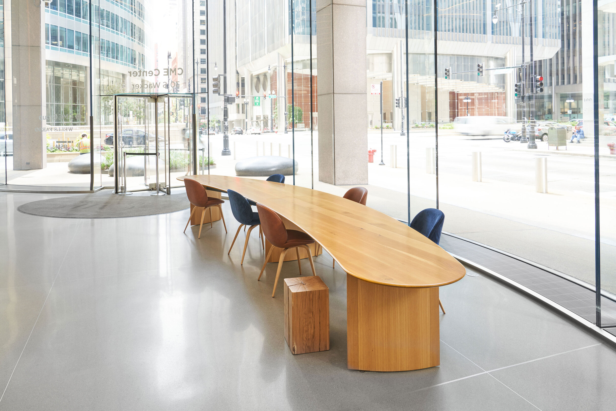 10-30 S Wacker Community Tables - Urban oak crescent-shaped top + oak veneer panel base