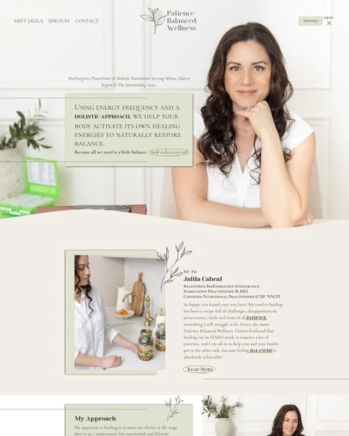 A woman with long brown hair, wearing a white top, sitting at a desk in a wellness clinic, smiling with her chin resting on her hand, in front of a logo that reads 'Palience Balanced Wellness' and various wellness-related decor.