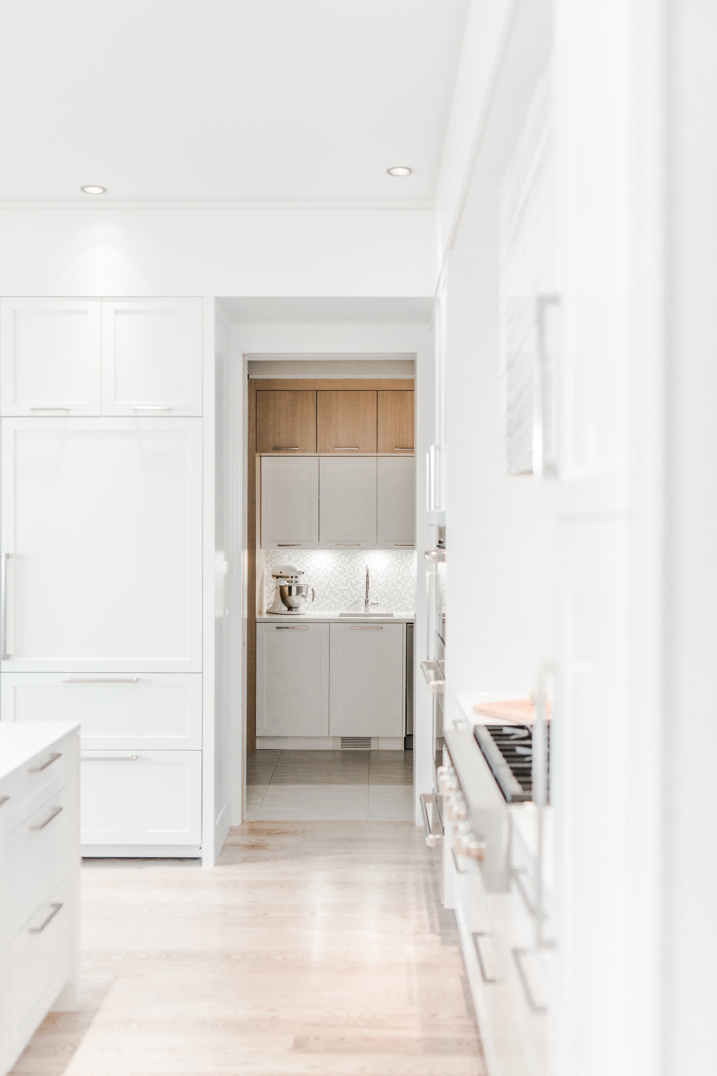 modern-luxury-kitchen-integrated-fridge-design-pantry-storage-loop-st-andrews-heights-project-calgary.jpg