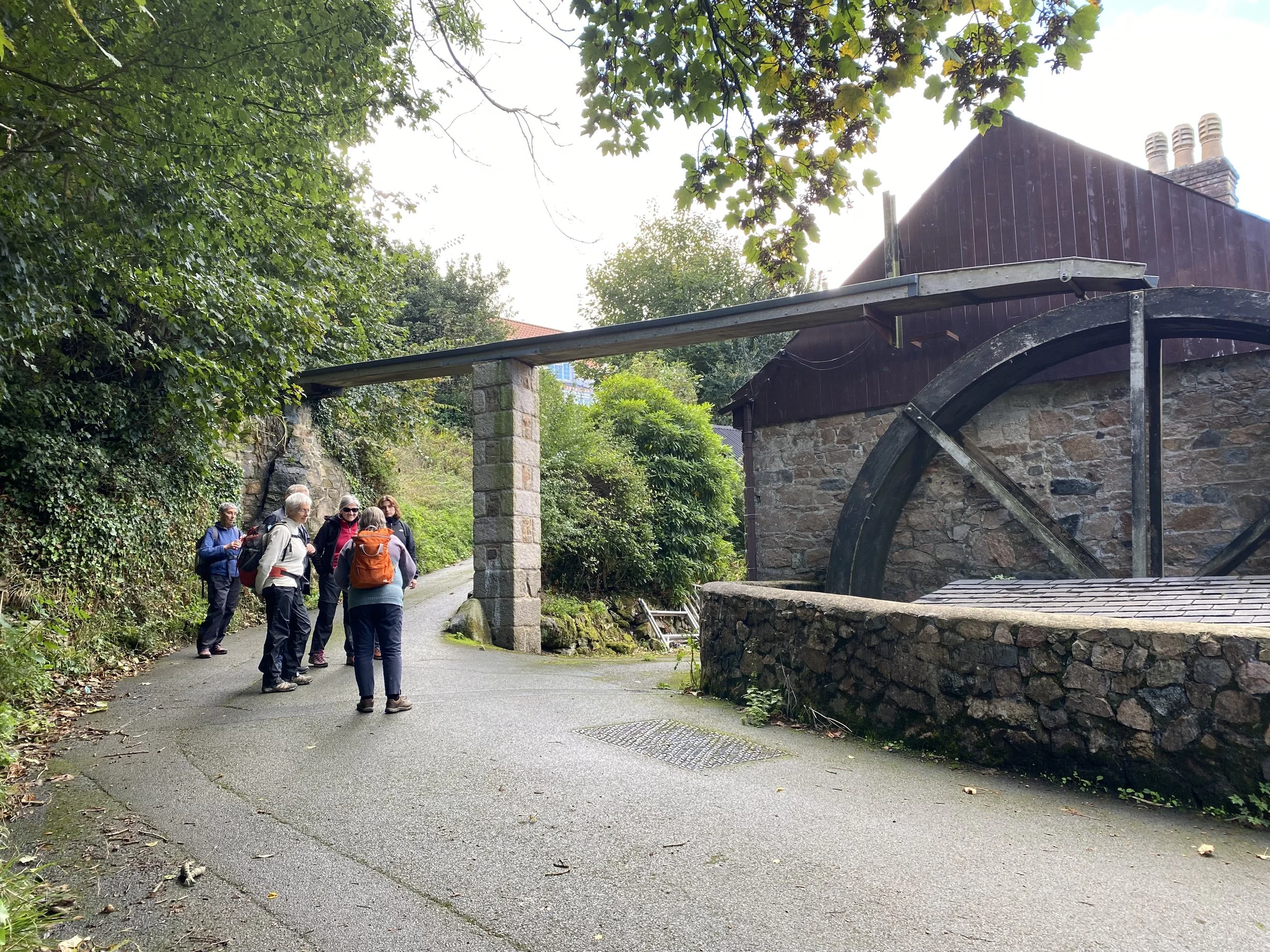 Visitors walking by the old mill