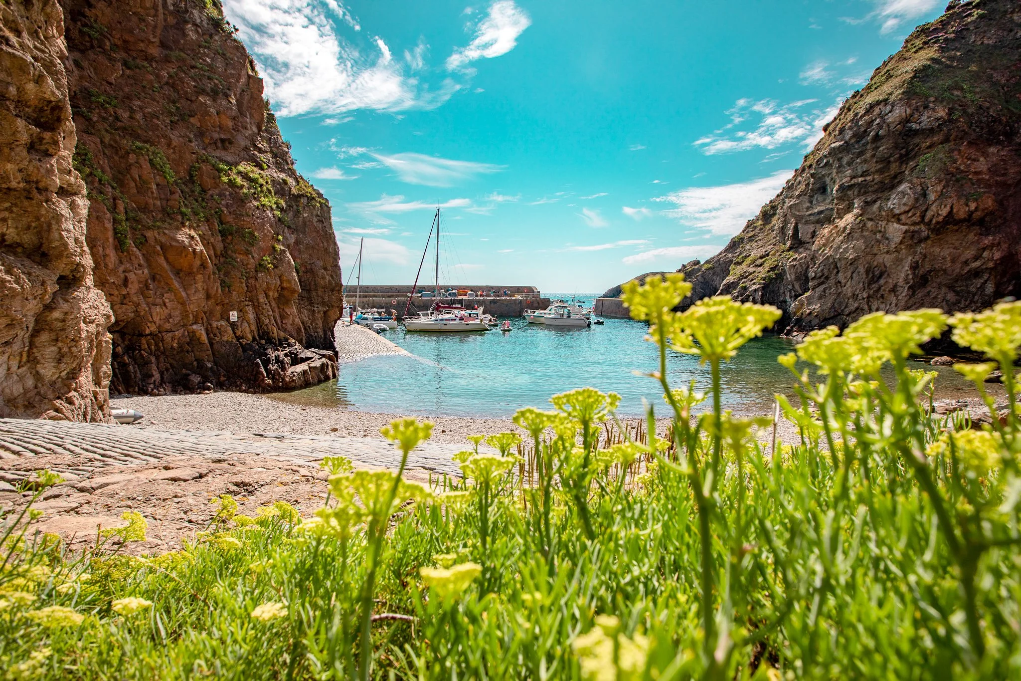 Creux Harbour in Guernsey with fishing boats and coastal views