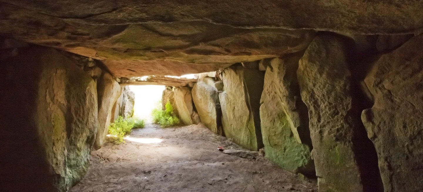 Inside La Varde Passage Grave on Guernsey, looking out towards landscape