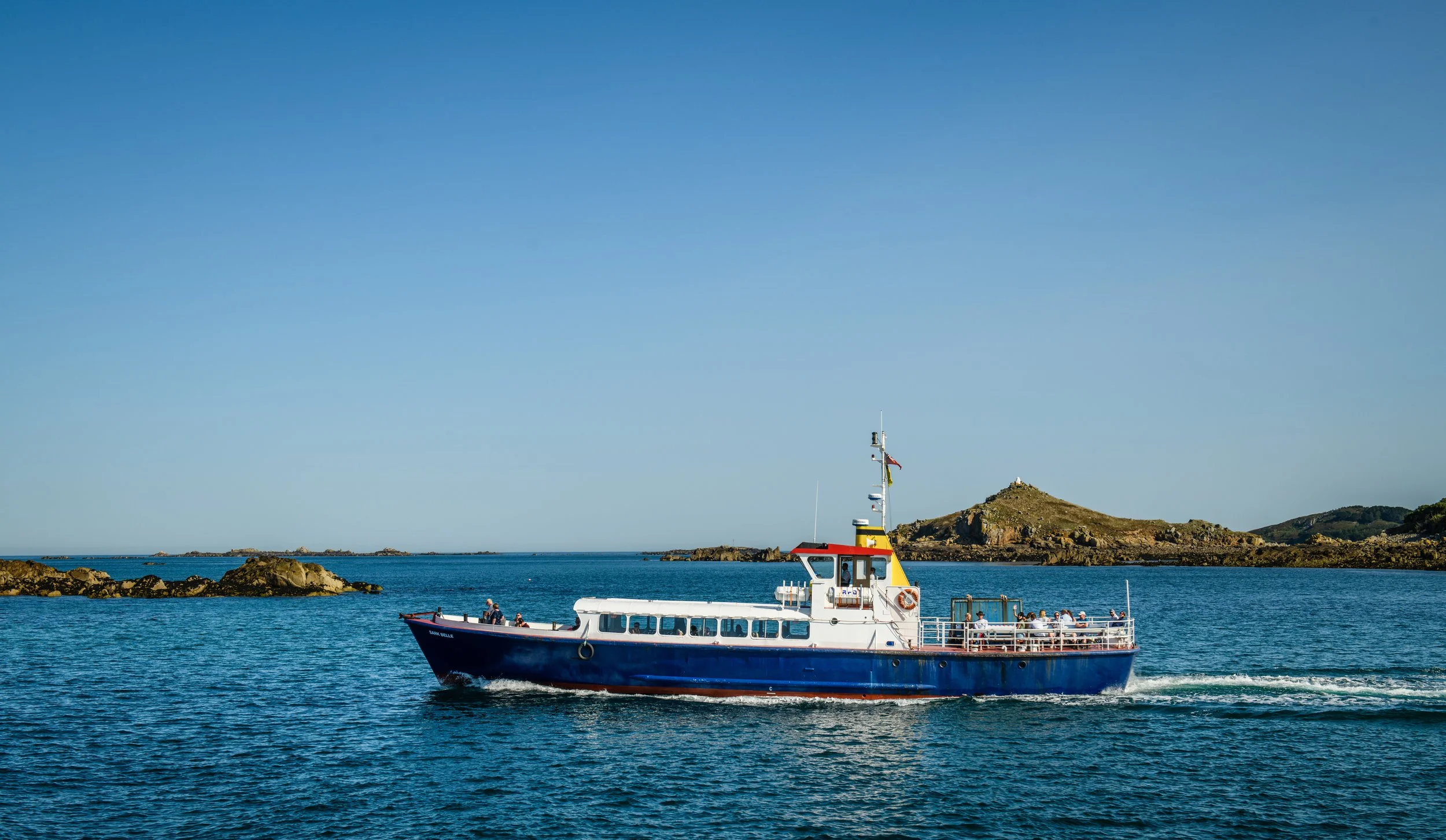 Boat approaching Sark Island from Guernsey with calm seas