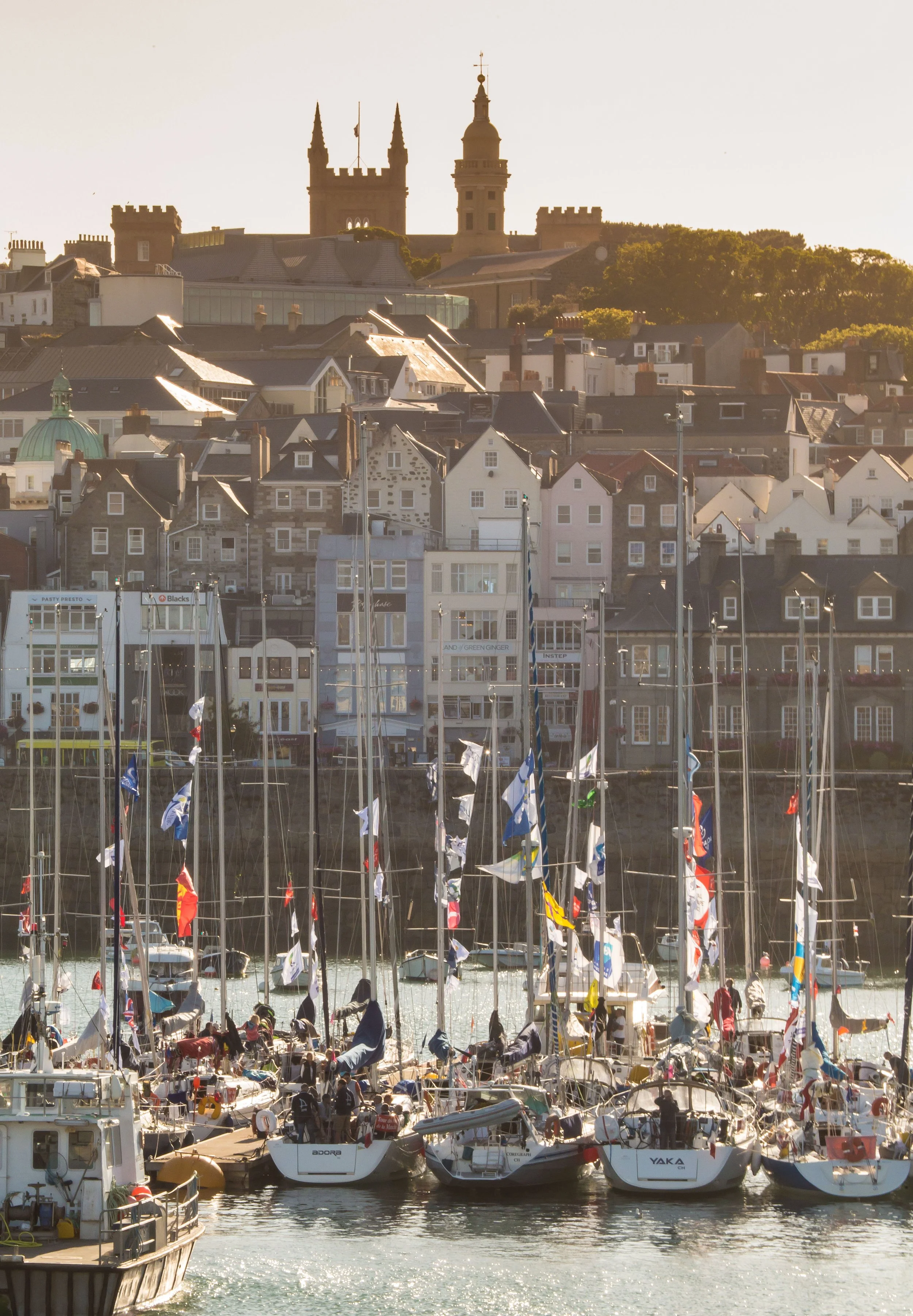 Historic Guernsey town centre with visitors enjoying a guided walking tour