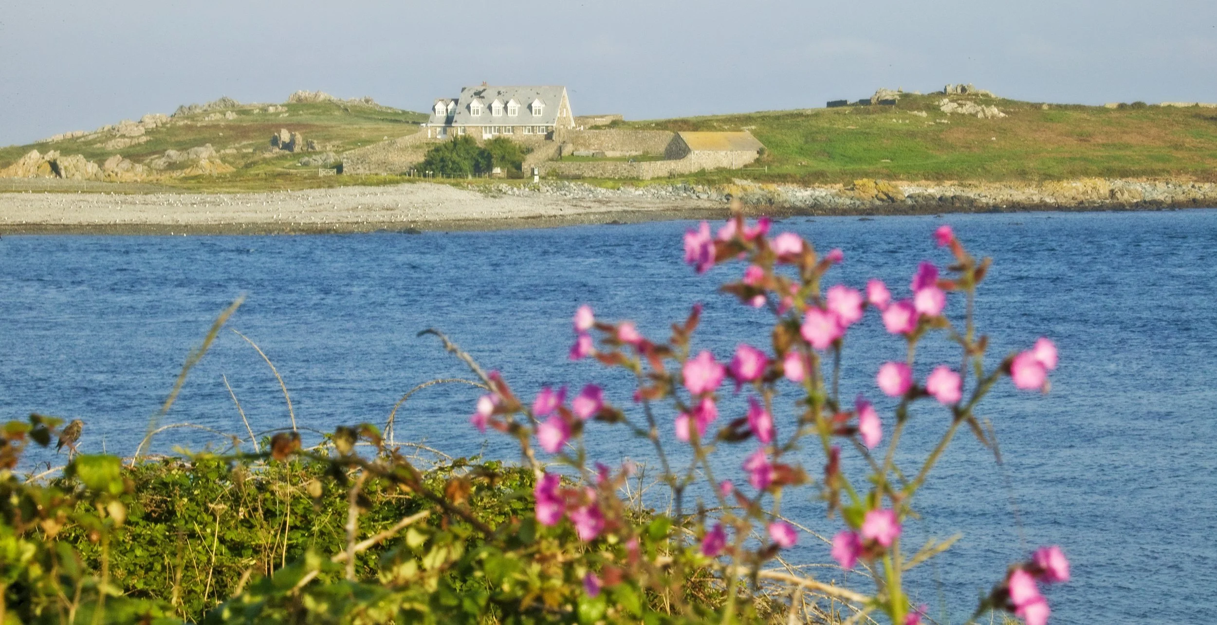 View of Lihou Island from Guernsey, showing the tidal causeway and coastline