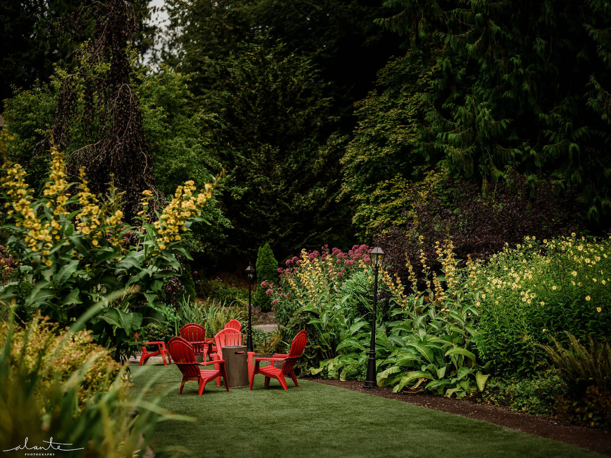The beautiful gardens surrounding a sitting area on the lower lawn. Photo by Alante Photography