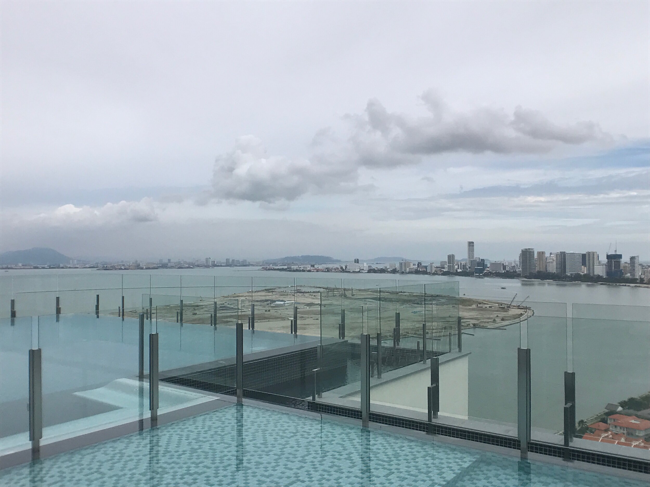 View from roof top of reclaimed island directly facing Straits Residences