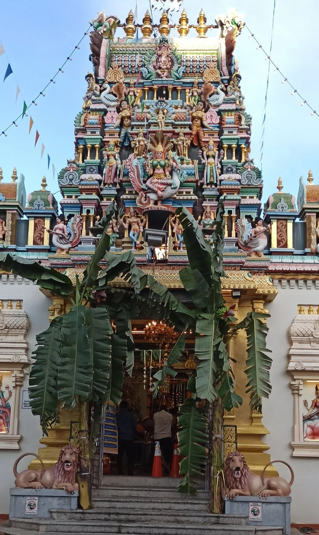 Performing morning puja at a Little India temple