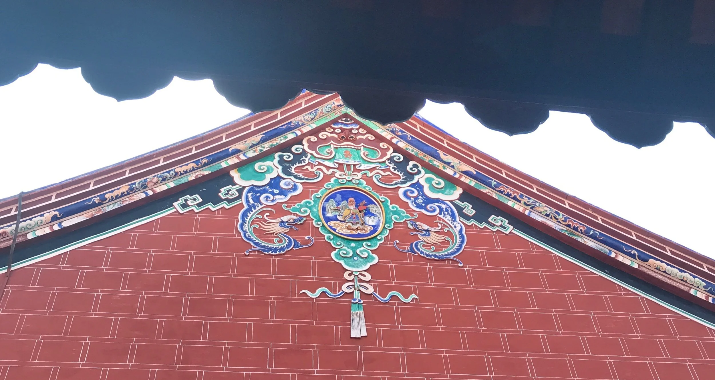 Detail of cracked porcelain decoration on roof