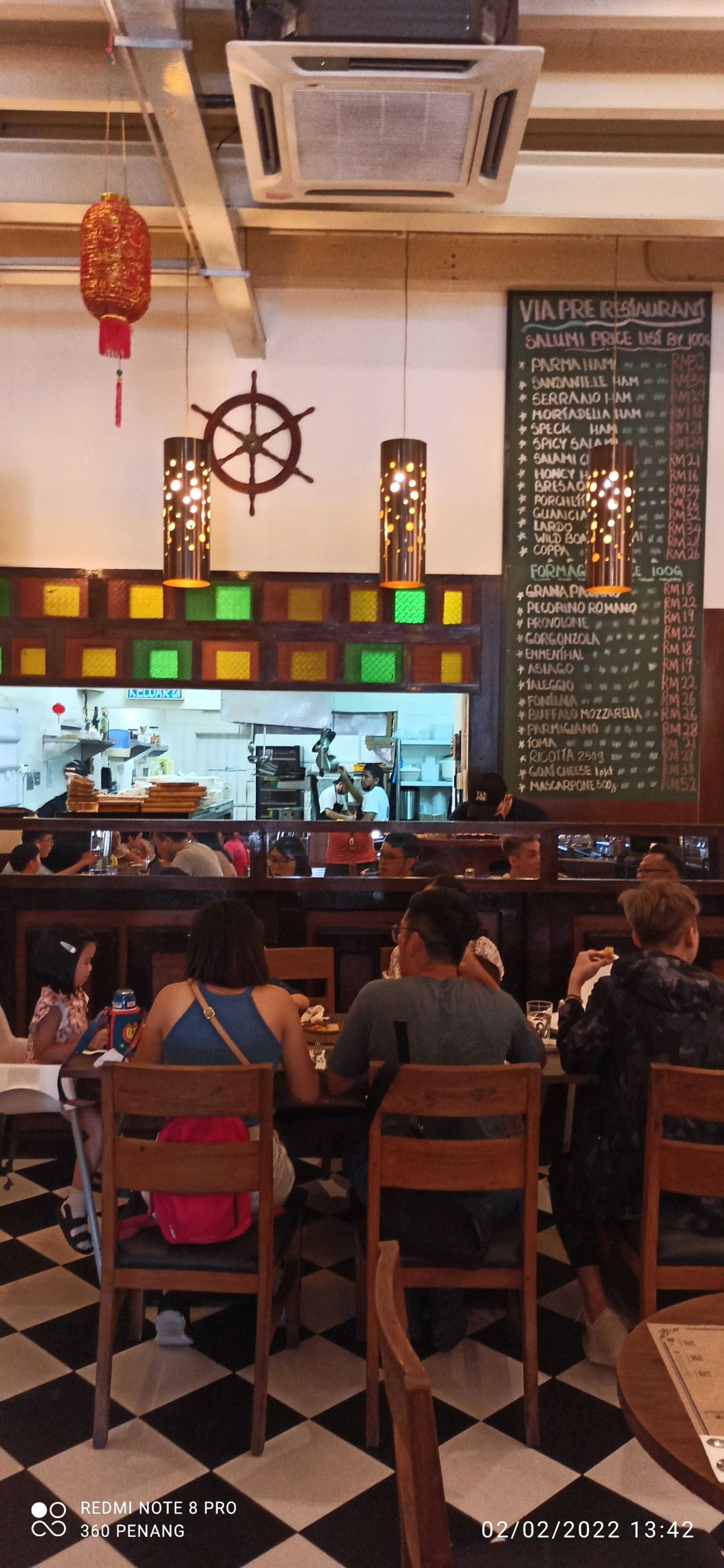 A large Malaysian family with two toddlers at lunch