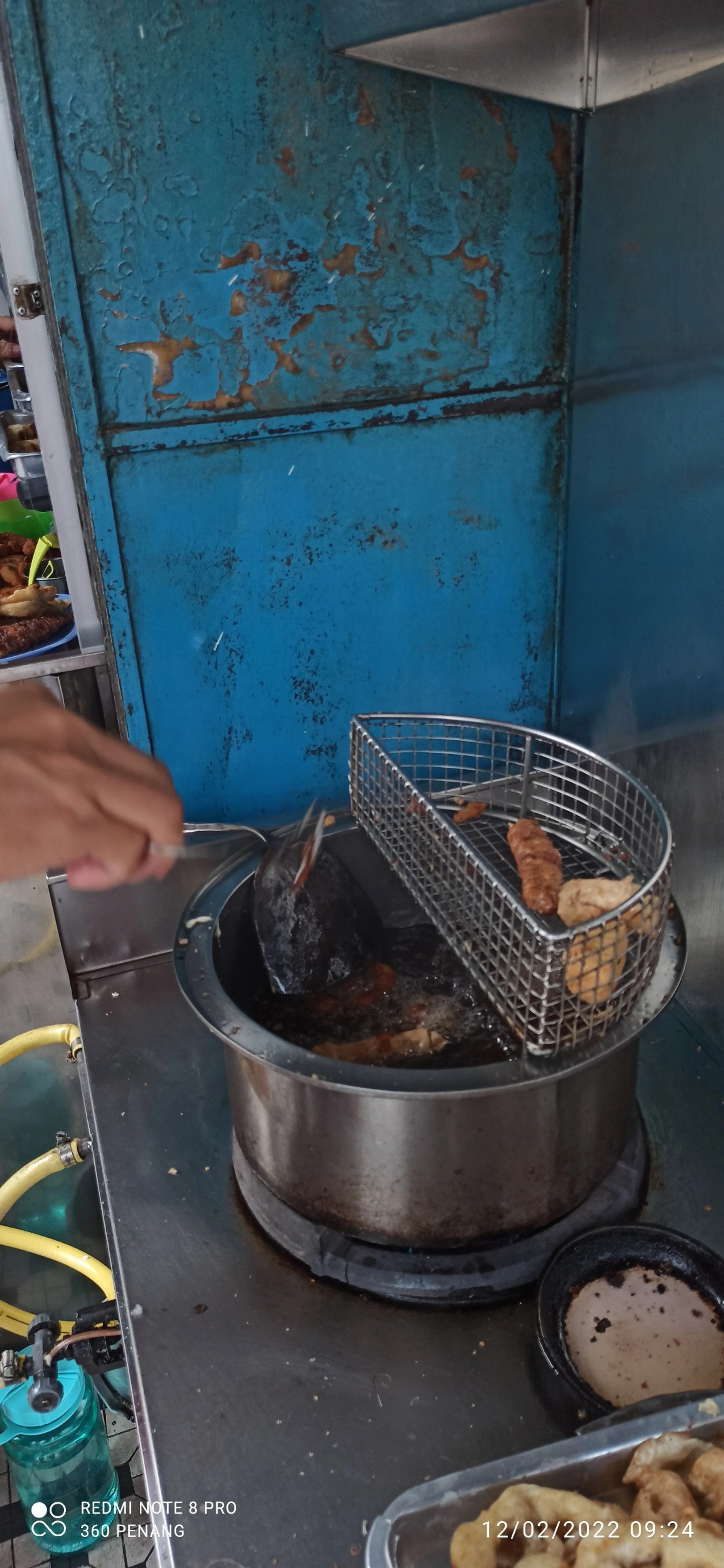 Note drainer over pot of oil