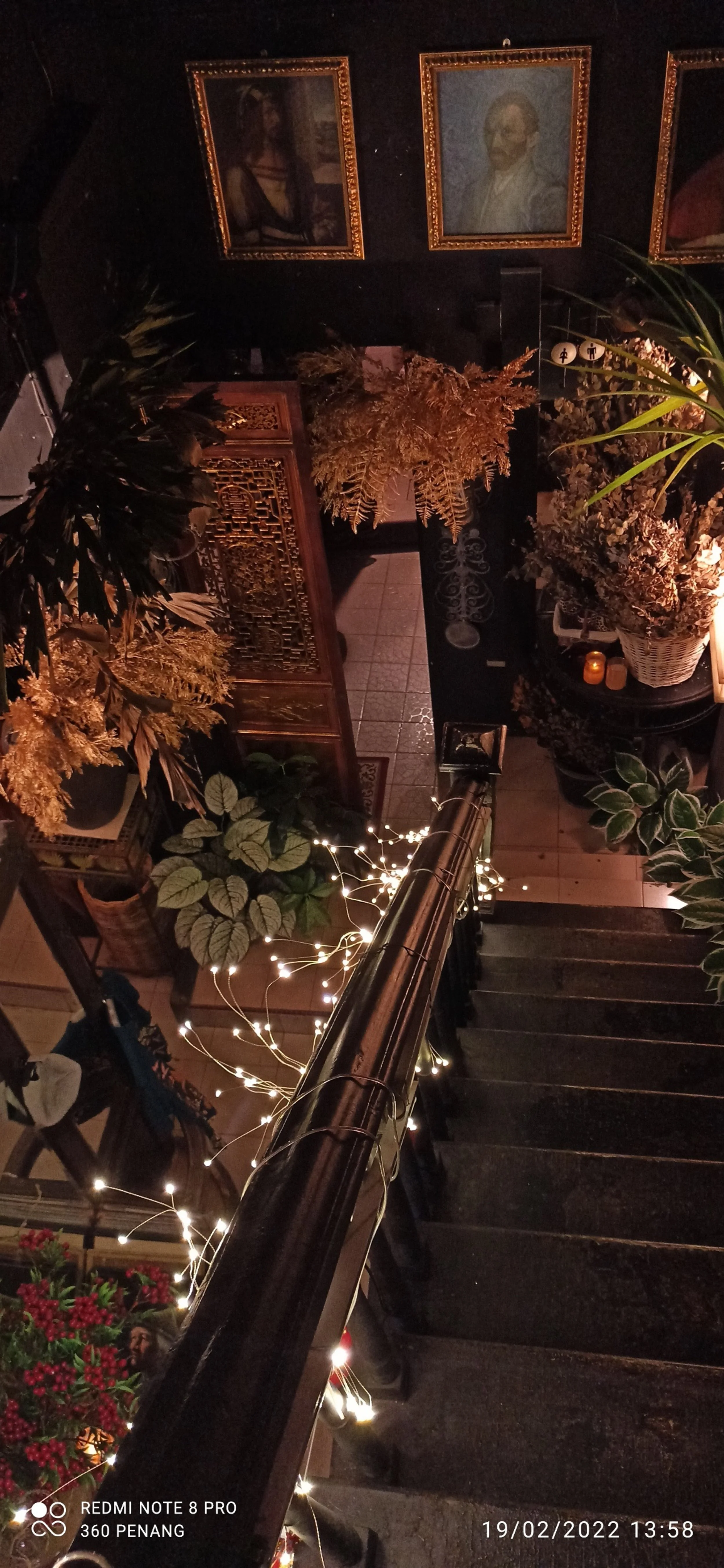 Staircase . Note Van Gogh self portrait on wall