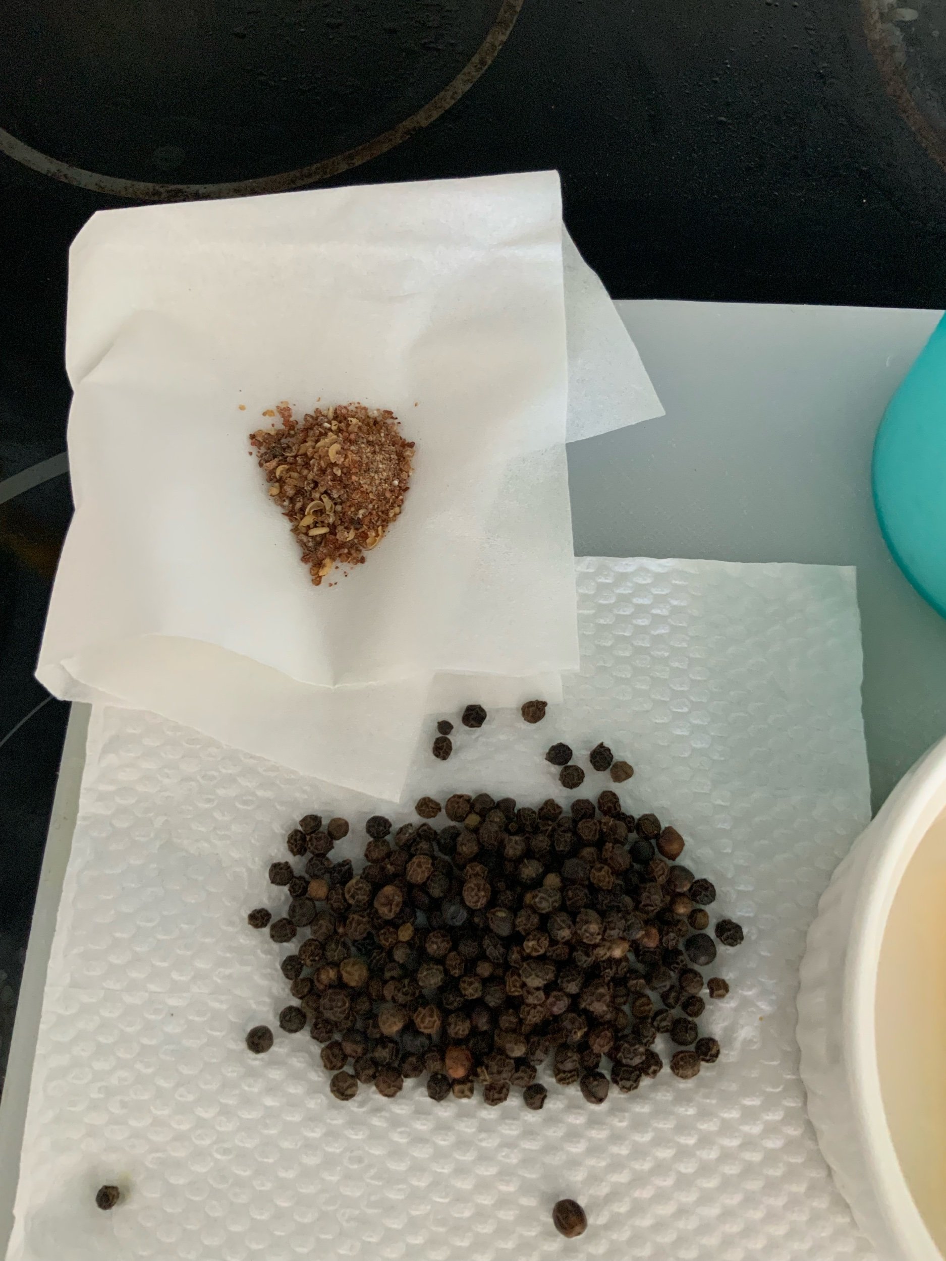 Black peppercorns with crushed Schezuan peppercorns
