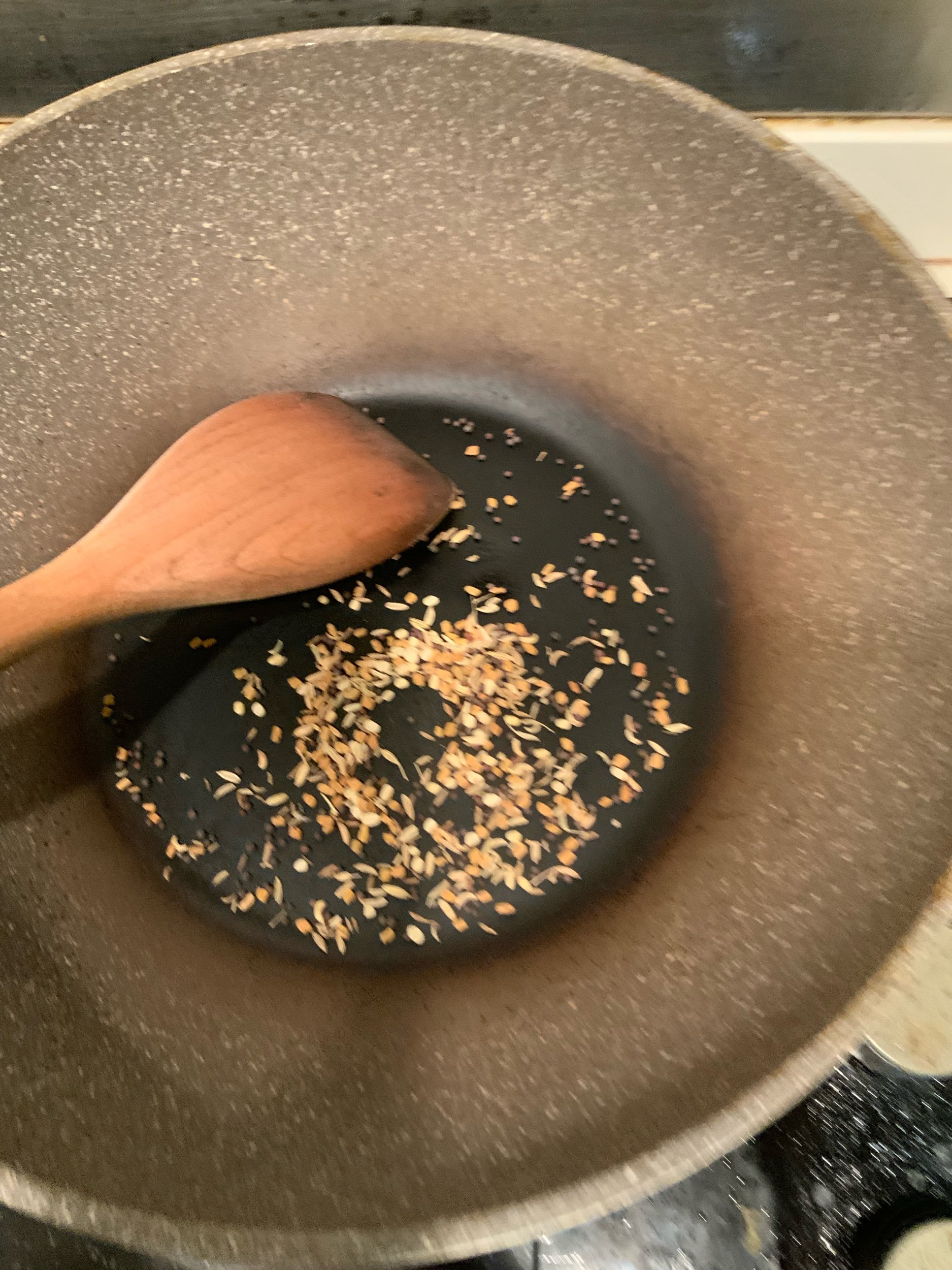 Toasting Halba mix seeds until aromatic