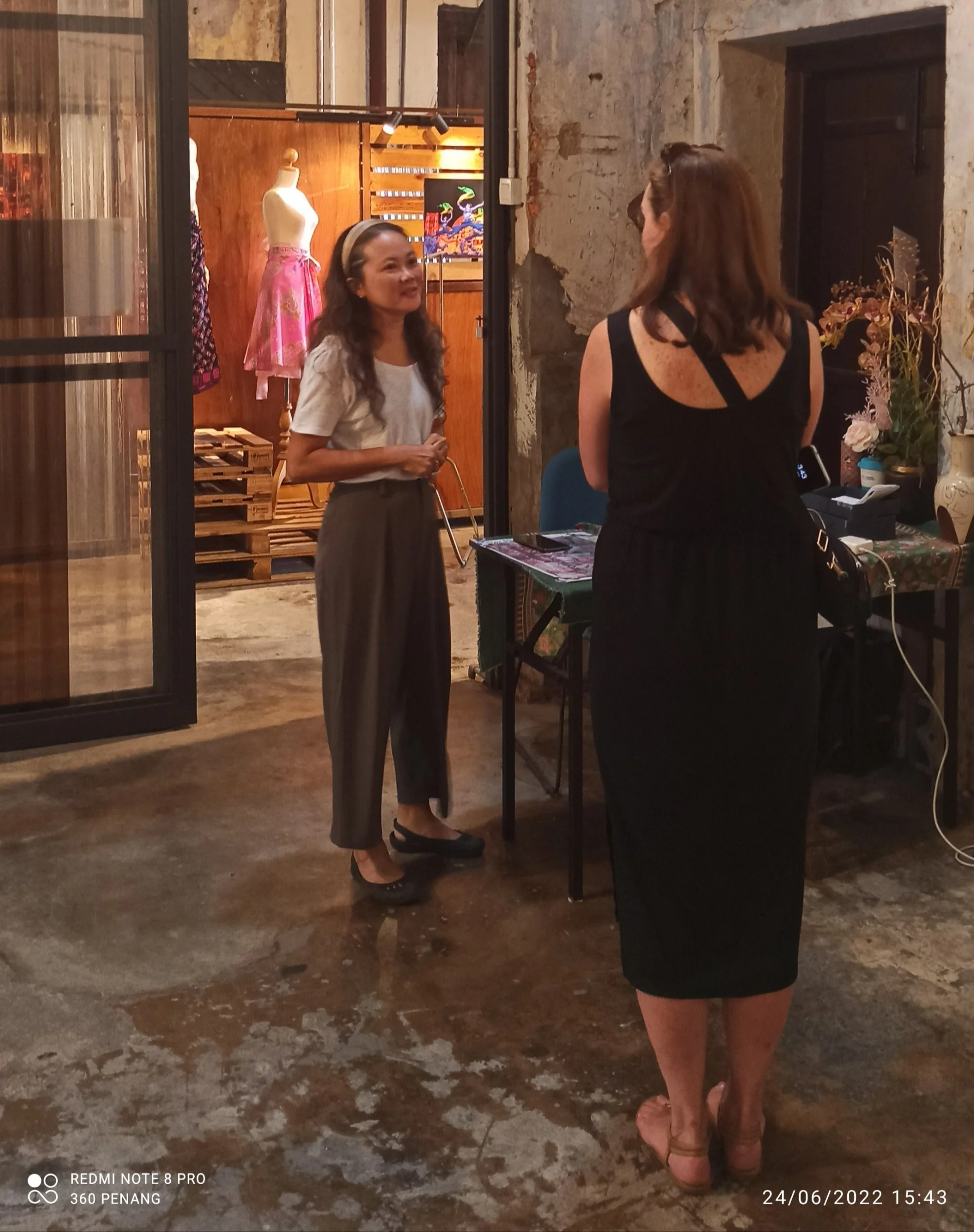 The artist (in white T shirt) in conversation with a visitor