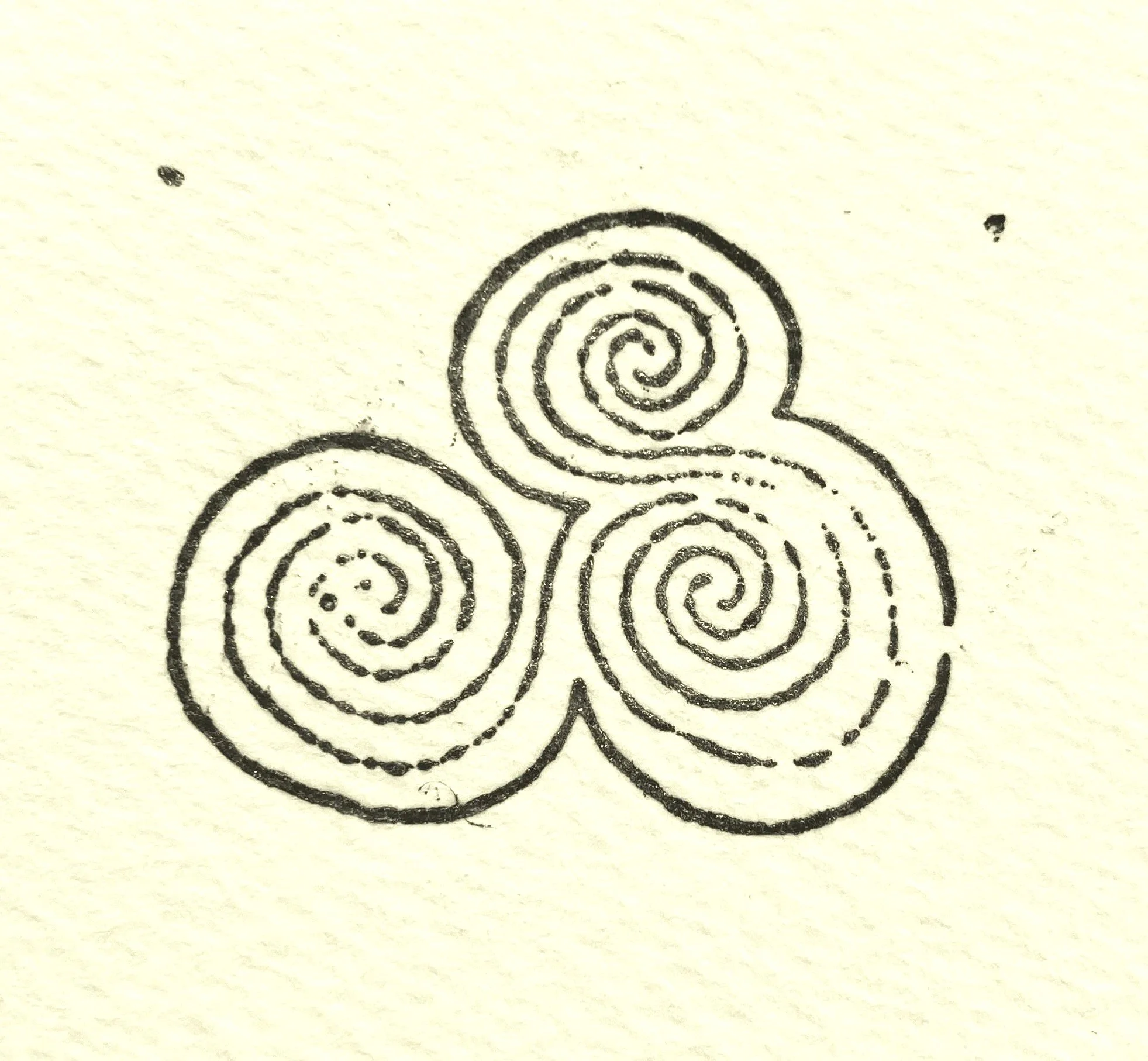Black ink drawing of three interconnected spirals on yellow paper.