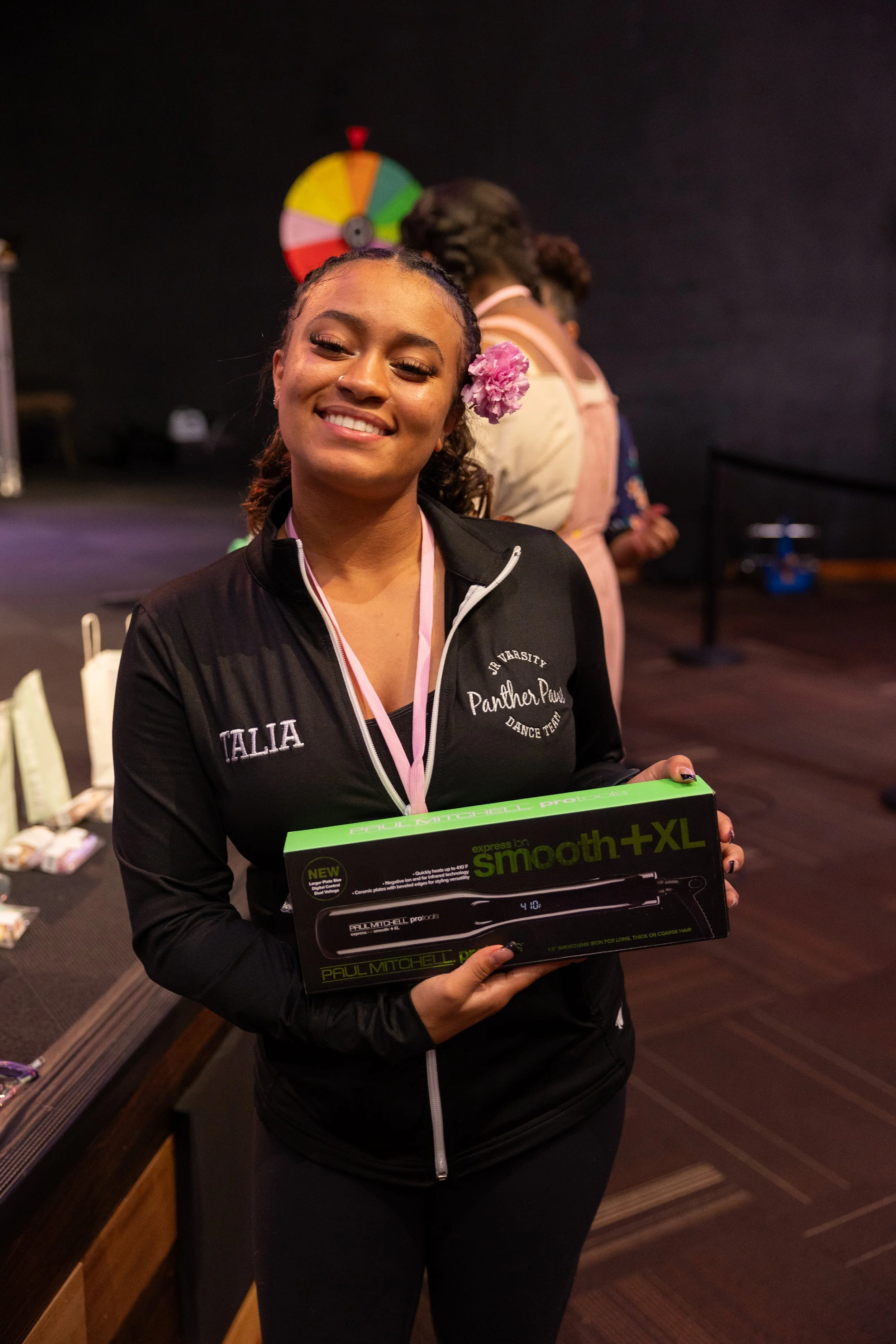 Talia Sharpe holds Paul Mitchell Hair Straightener