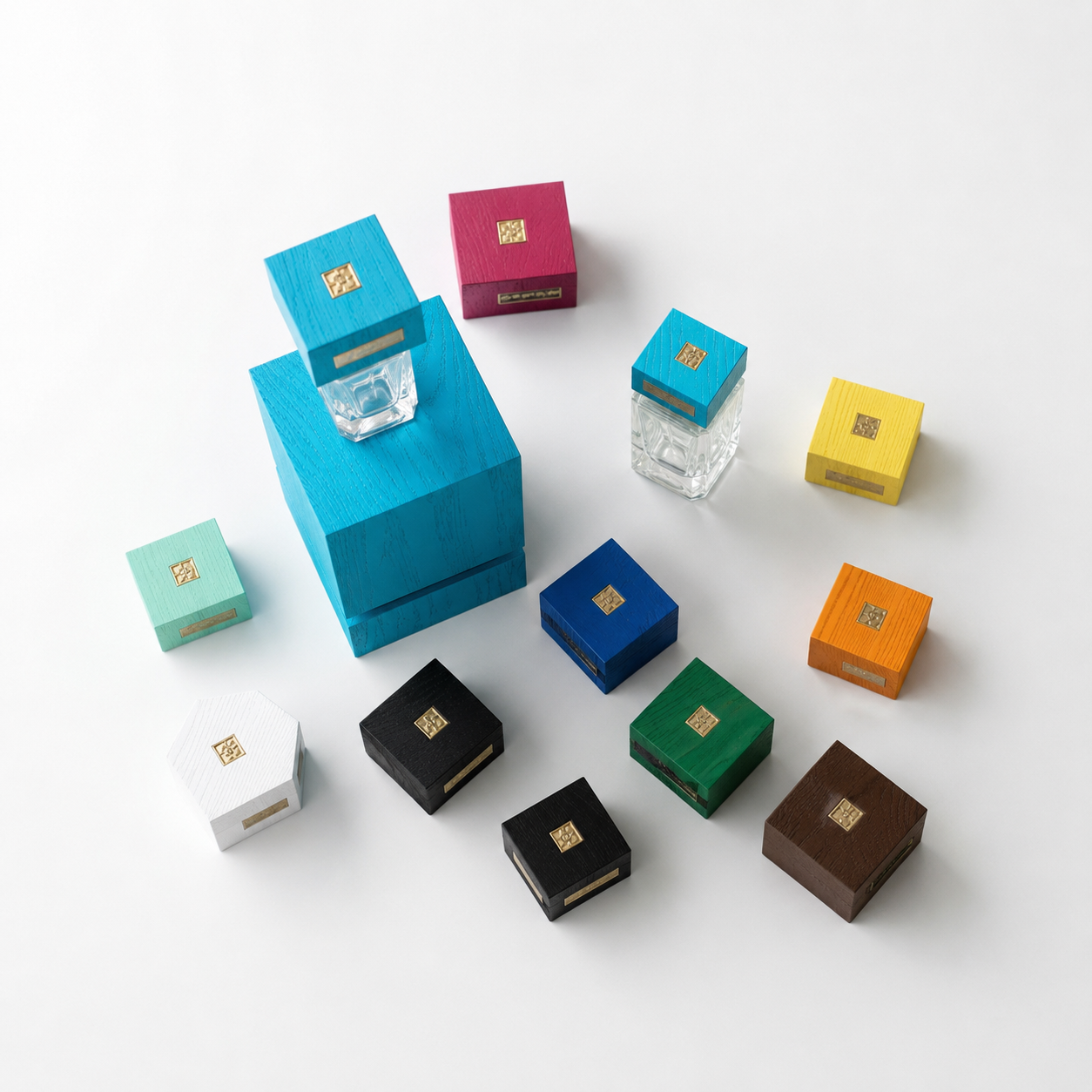 Colorful wooden and glass stamps arranged on a white surface, with different shapes and sizes.