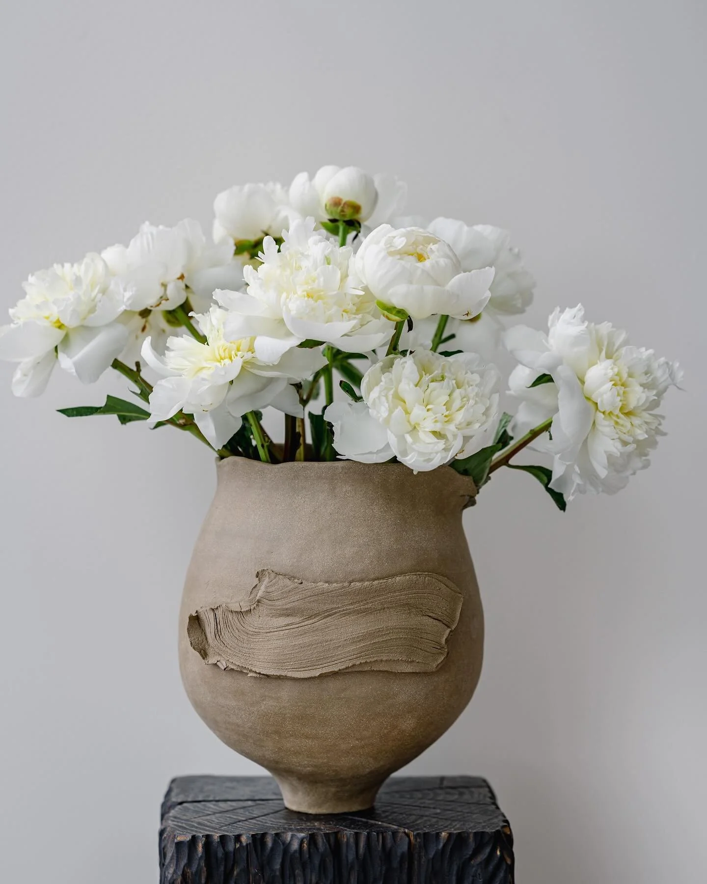 [One-of-a-kind]

I love the contrast between the simplicity and rawness of the unglazed vessel and the subtle beauty of peonies.

&ldquo;We need the handmade to balance the mind-numbingly similar machine-made things around us, things that can only ev