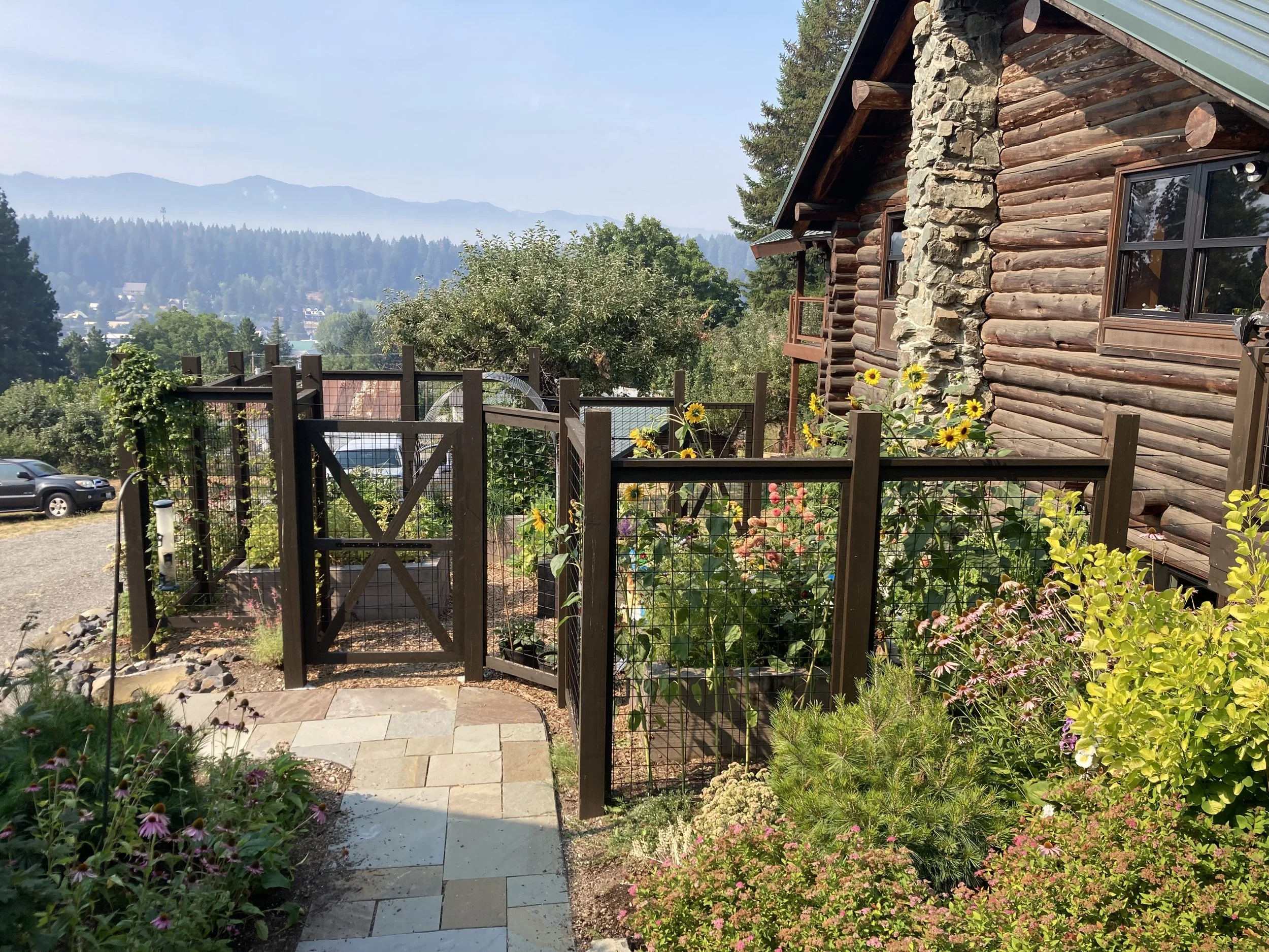After - A thriving season of vegetables and annual flowers. The fence was done by RQ Concepts.