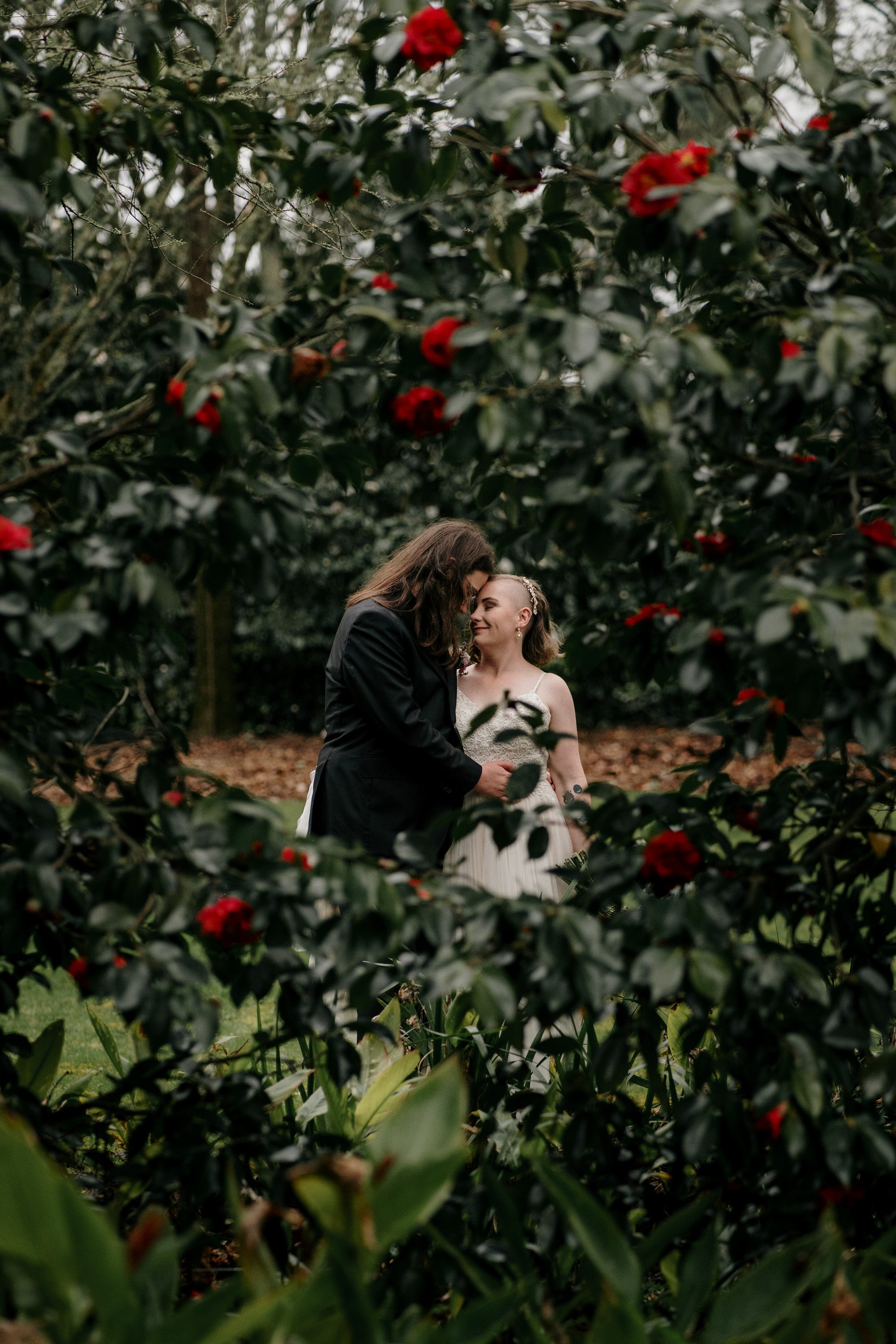 tabula-rasa-top-auckland-wedding-phtographer-NZ-best-photography-videography-film-new-zealand-NZ-top-garden-venue-cherry-blossom-spring-2023-rainy-day-hilton-bride-and-groom-dear-white-productions  (478).jpg