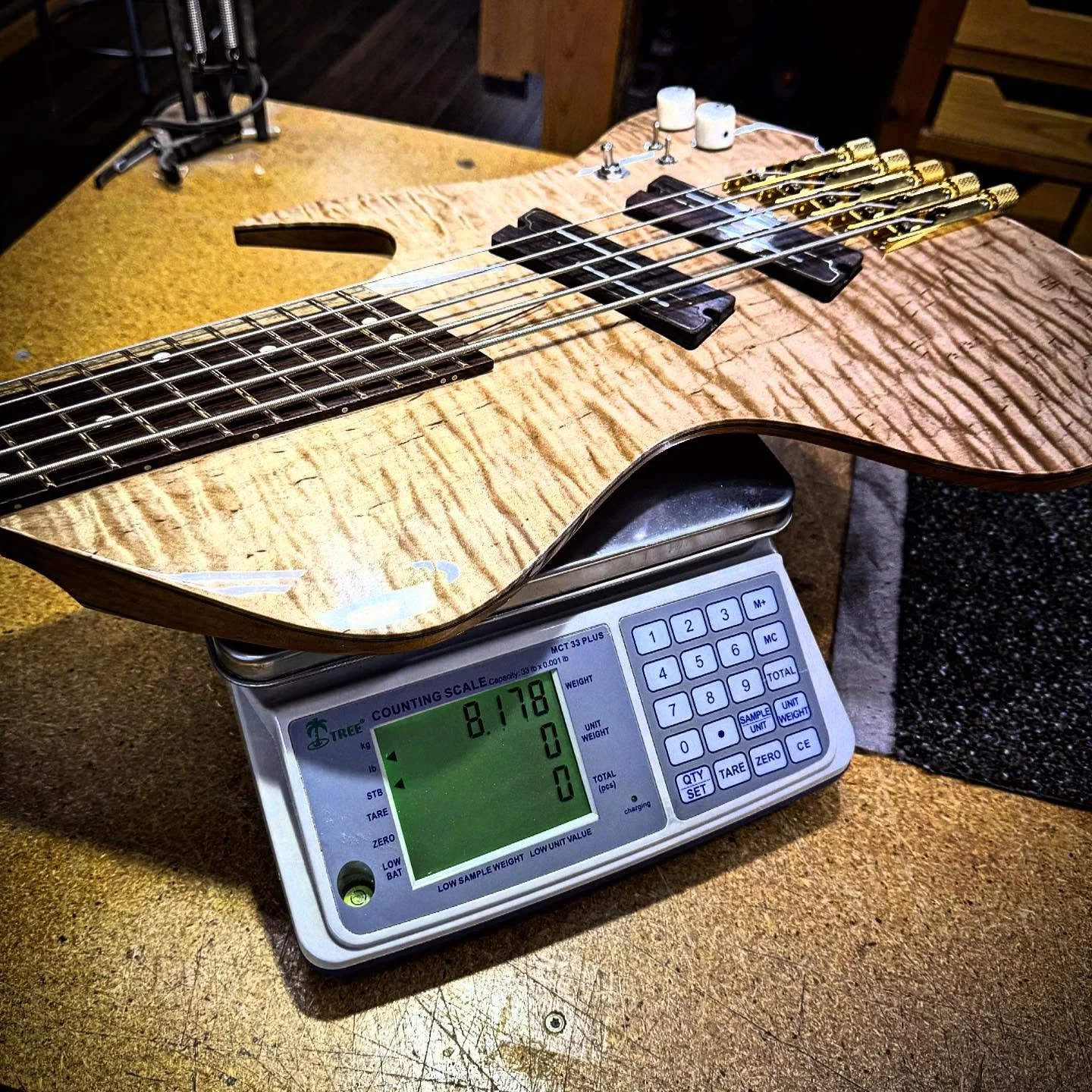 Pretty dang light for a solid body 5 string bass. 

#LutherieArt #FineWoodworking #HandcraftedGuitars #CustomGuitar #LuxuryGuitar #GuitarBuilder #WoodworkingMastery #ExquisiteCraftsmanship #BoutiqueGuitars #HandmadeInstruments #HighEndGuitar #Artisan