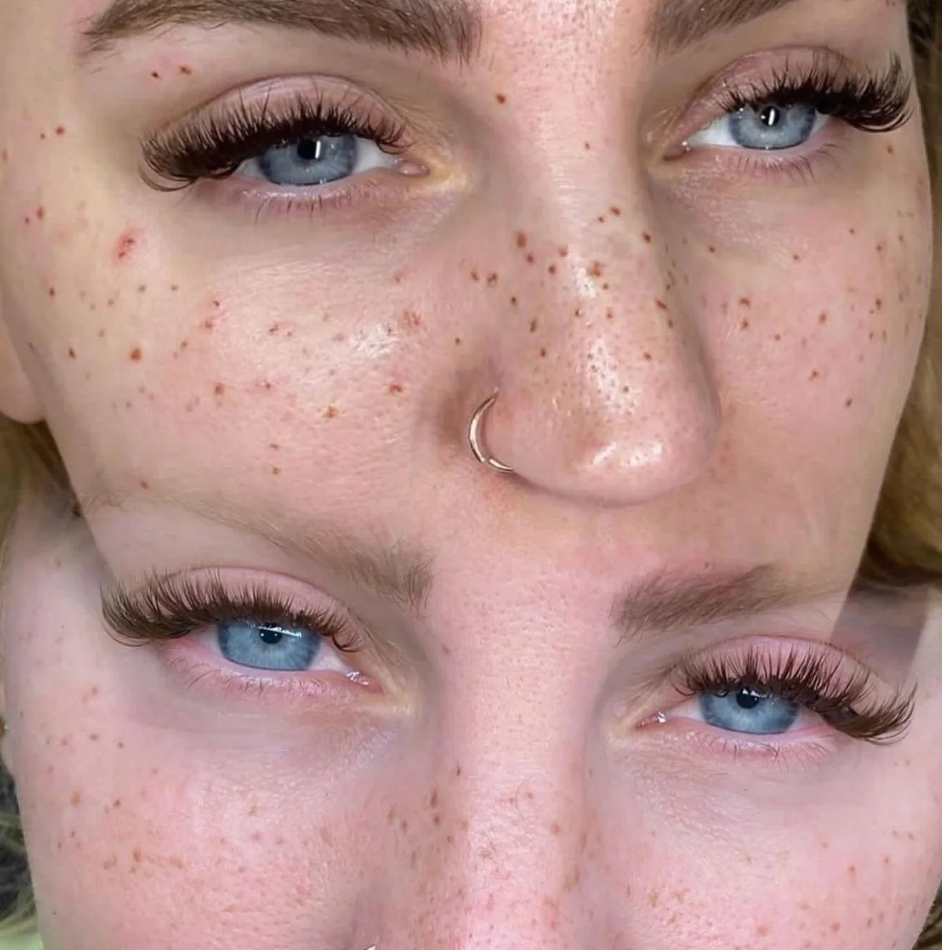 Close-up of a woman's face showcasing clear skin with tattooed freckles