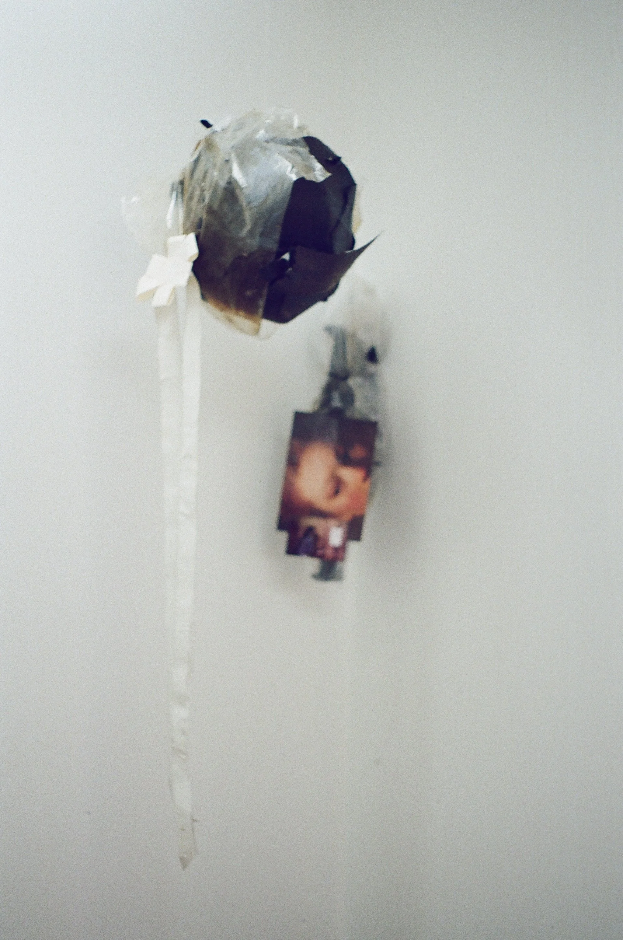 Basement Life 1, 2026
oil and acrylic on asphalt paper with tape, plastic, wire,
photos