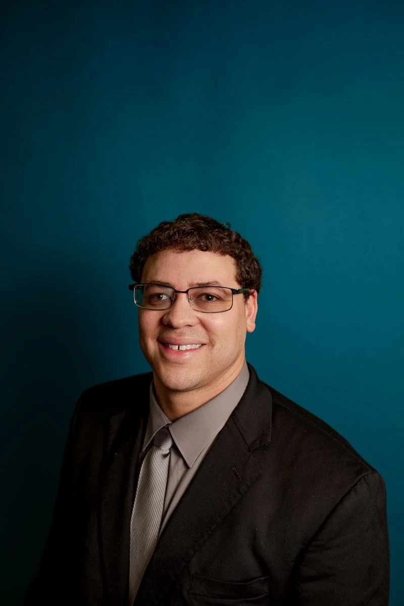 simple headshot on blue backdrop