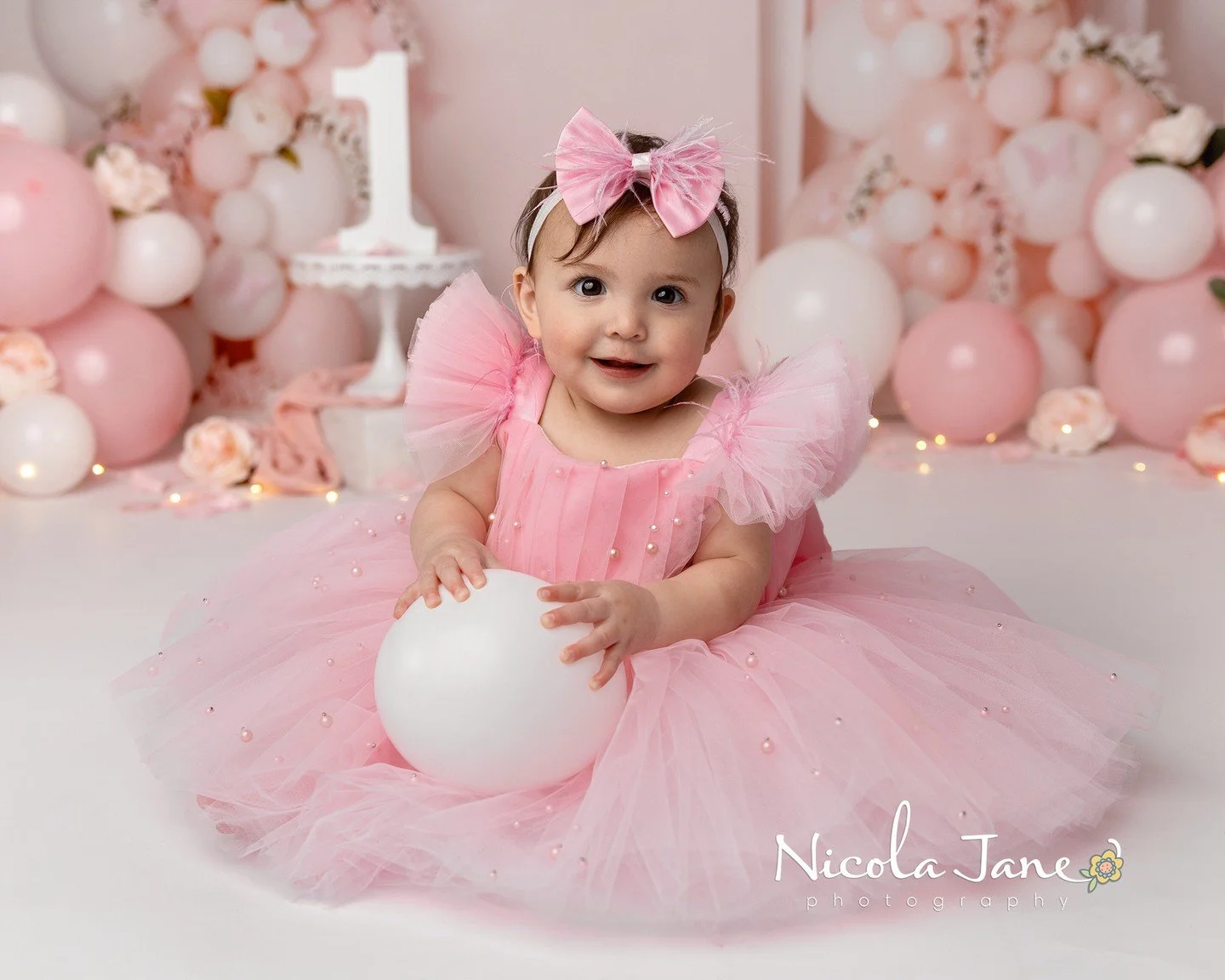 Isn&rsquo;t this just the epitome of a little girl? 🩷

The fluffy pink dress.
The tiny bow.
The sweet little smile.

This session is also the perfect reminder that first birthday sessions don&rsquo;t always need cake to be absolutely magical.

Some 