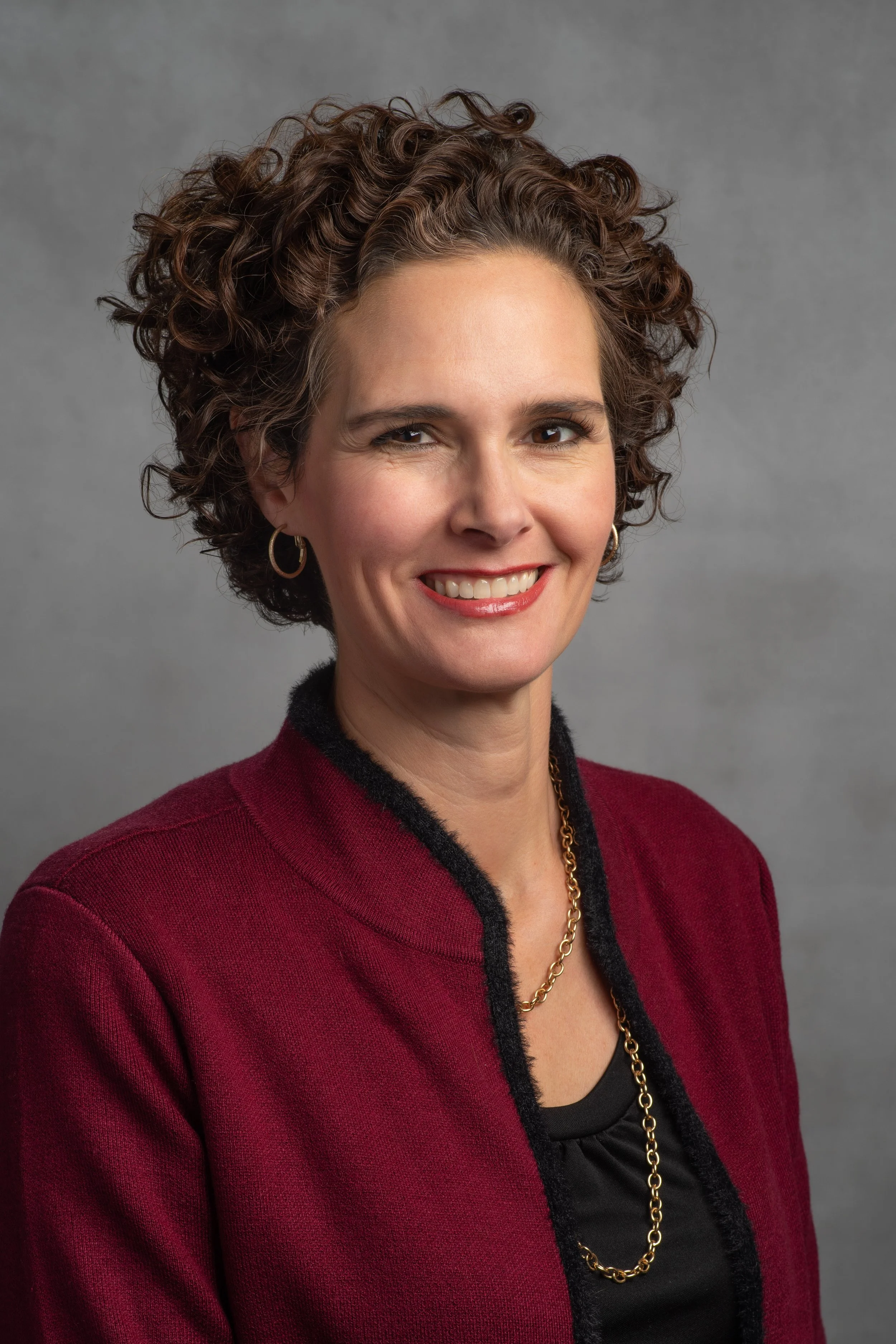 A finance investment professional woman's headshot